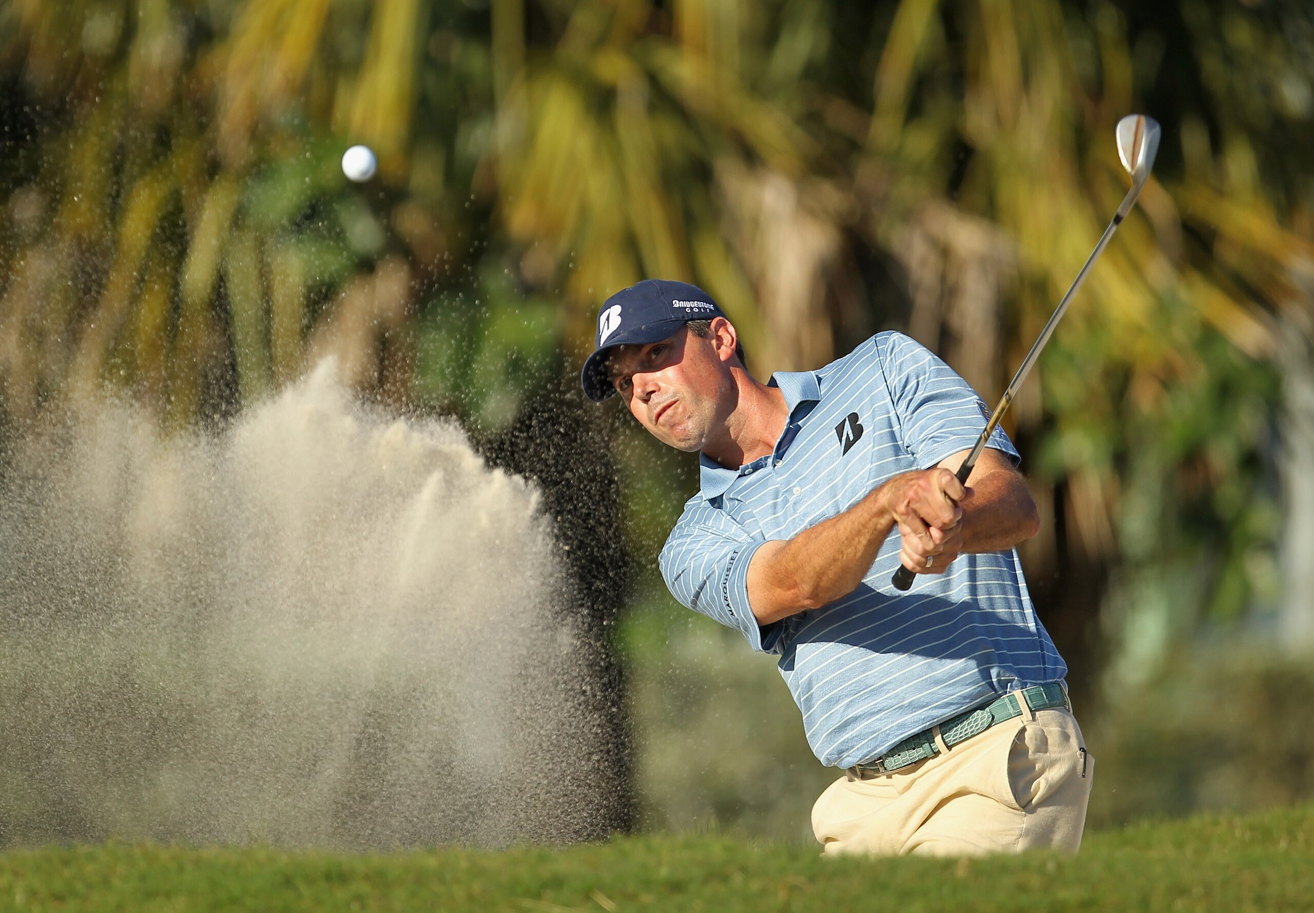 DORAL, FL - MARCH 13: Matt Kuchar hits a bunker shot on the 13th hole during the final round of the 2011 WGC- Cadillac Championship at the TPC Blue Monster at the Doral Golf Resort and Spa on March 13, 2011 in Doral, Florida. (Photo by Mike Ehrmann/Gett DORAL, FL - MARCH 13: Matt Kuchar hits a bunker shot on the 13th hole during the final round of the 2011 WGC- Cadillac Championship at the TPC Blue Monster at the Doral Golf Resort and Spa on March 13, 2011 in Doral, Florida. (Photo by Mike Ehrmann/Gett