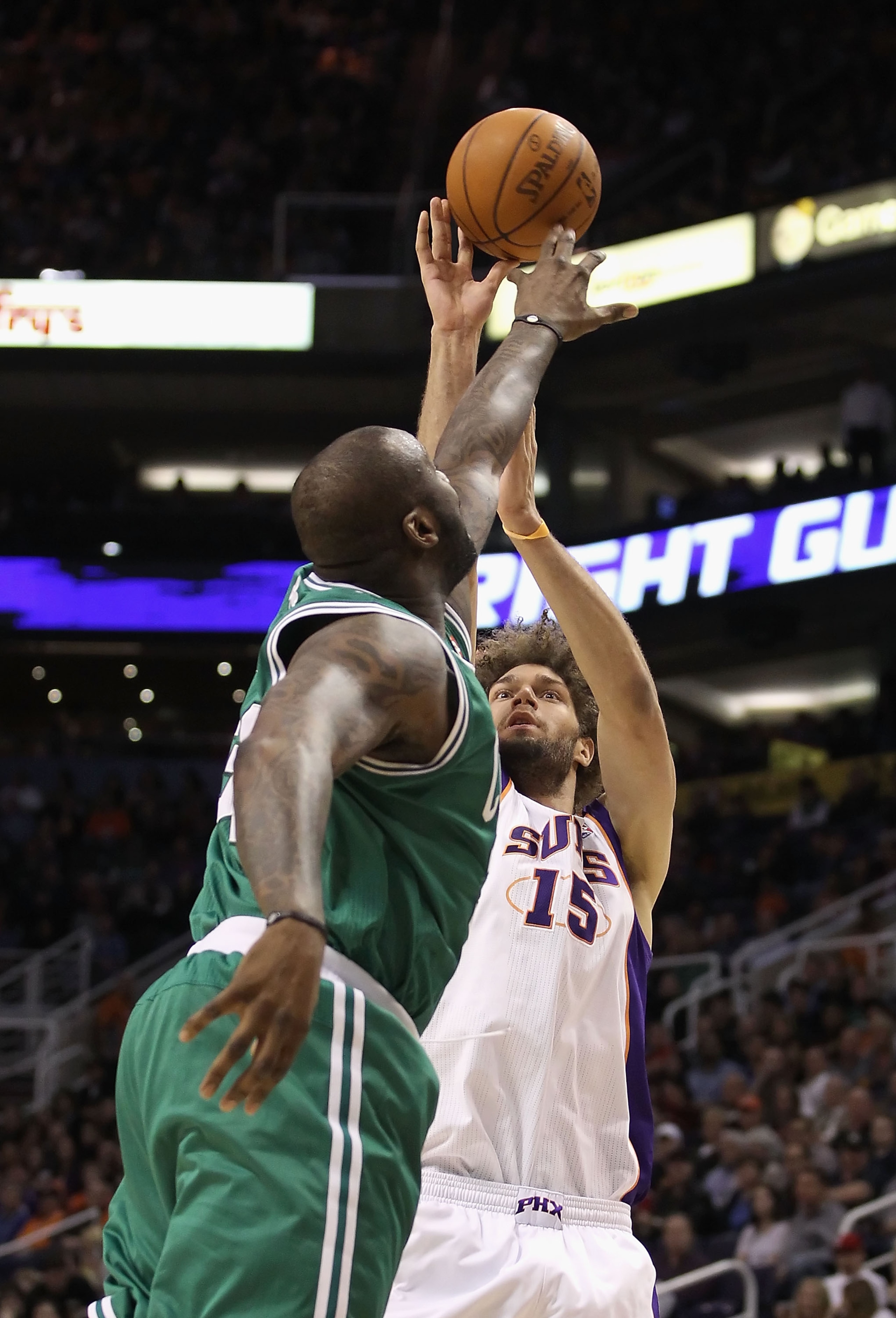 PHOENIX, AZ - JANUARY 28:  Shaquille O'Neal #36 of the Boston Celtics blocks a shot from Robin Lopez #15 of the Phoenix Suns during the NBA game at US Airways Center on January 28, 2011 in Phoenix, Arizona.  The Suns defeated the Celtics 88-71.  NOTE TO U