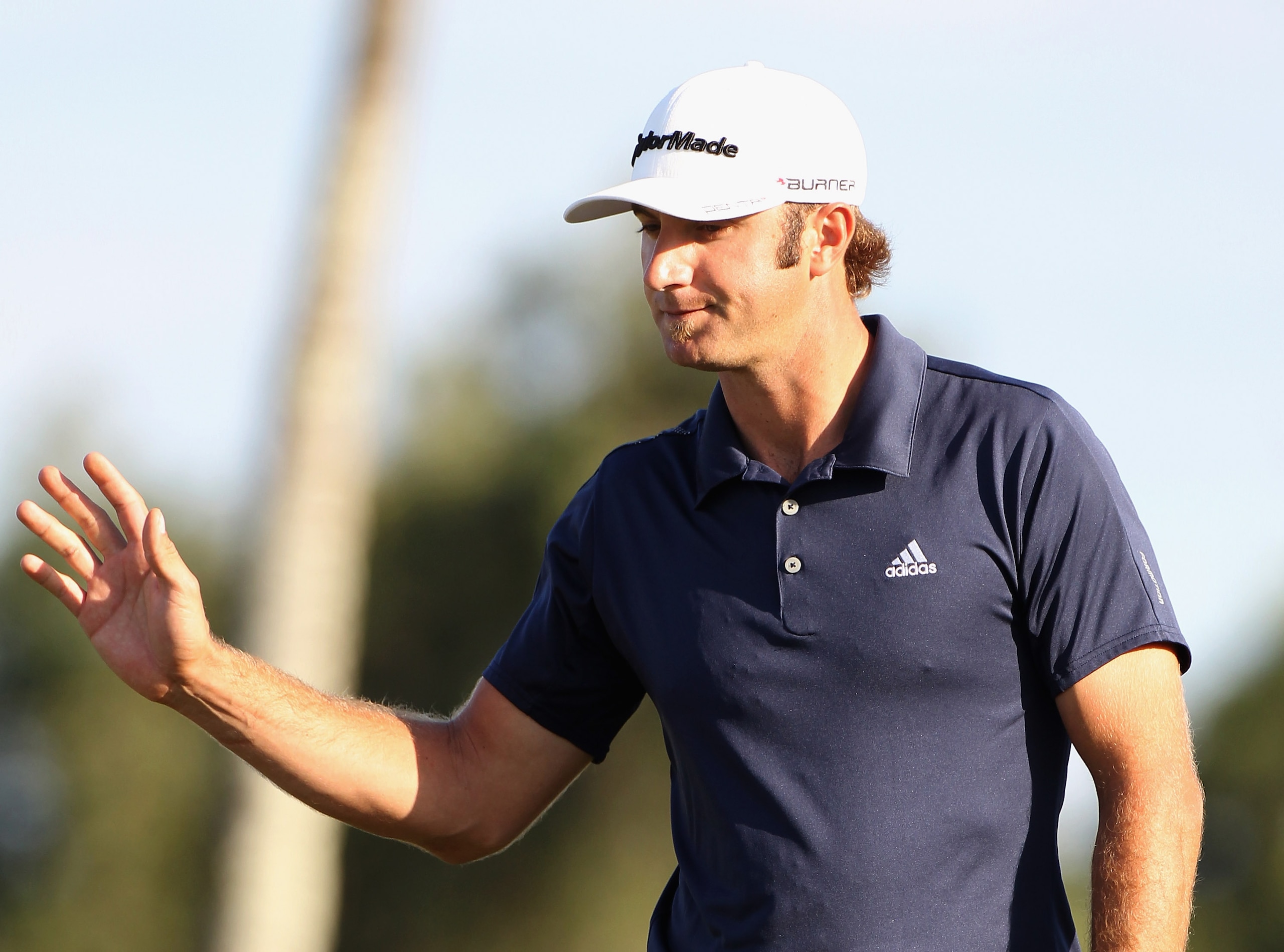 DORAL, FL - MARCH 12: Dustin Johnson celebrates a birdie putt on the 17th hole during the third round of the 2011 WGC- Cadillac Championship at the TPC Blue Monster at the Doral Golf Resort and Spa on March 12, 2011 in Doral, Florida. (Photo by Sam Gree DORAL, FL - MARCH 12: Dustin Johnson celebrates a birdie putt on the 17th hole during the third round of the 2011 WGC- Cadillac Championship at the TPC Blue Monster at the Doral Golf Resort and Spa on March 12, 2011 in Doral, Florida. (Photo by Sam Gree