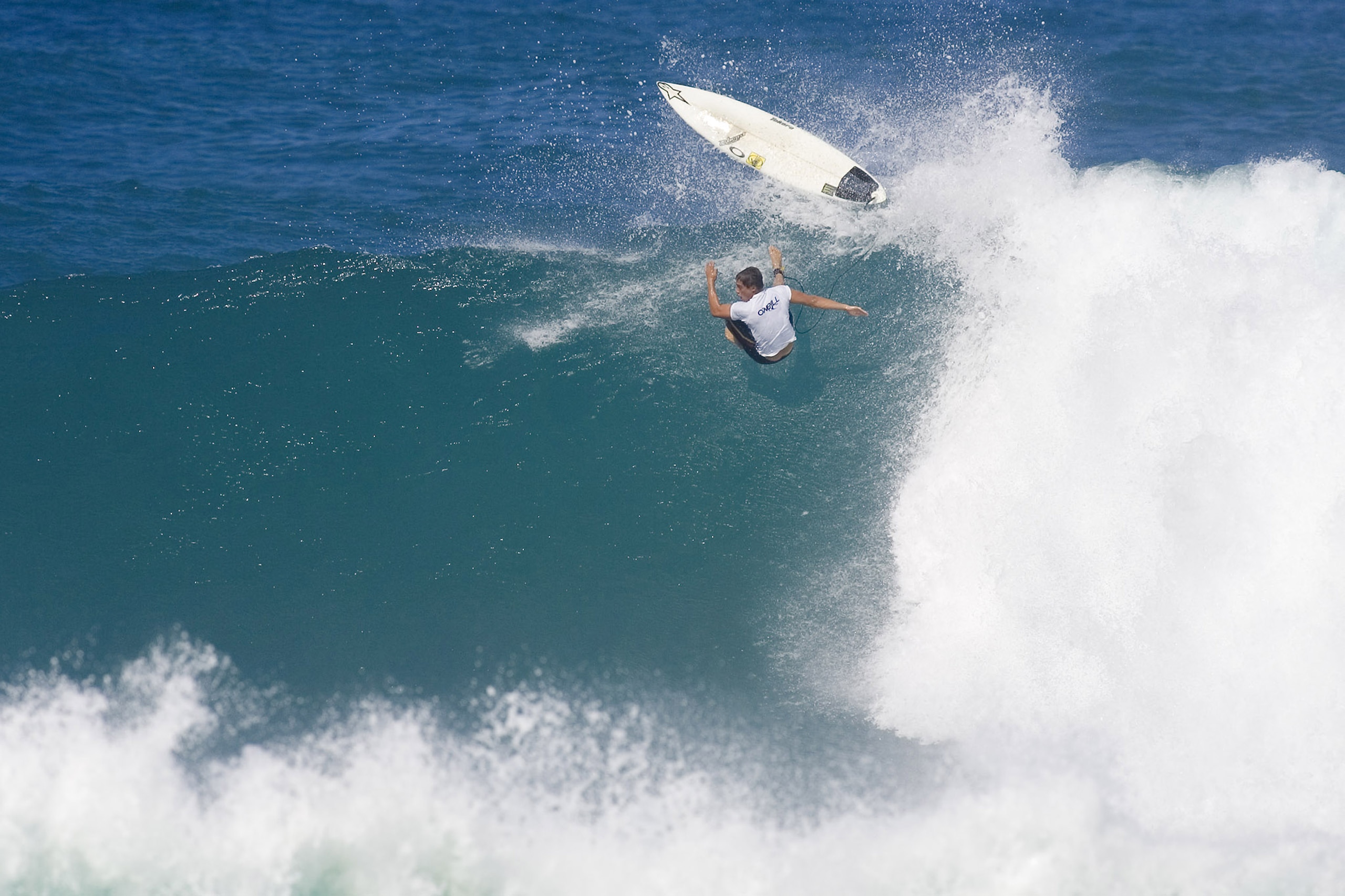OAHU, HI - NOVEMBER 27:  (EDITORIAL USE ONLY) In this handout from Tostee.com, despite suffering a heavy wipeout, Makua Rothman (HI) wins his heat against Adrian Buchan of Australia, Bernardo Pigmeu of Brazil and Mike Todd of Australia in the round of 96