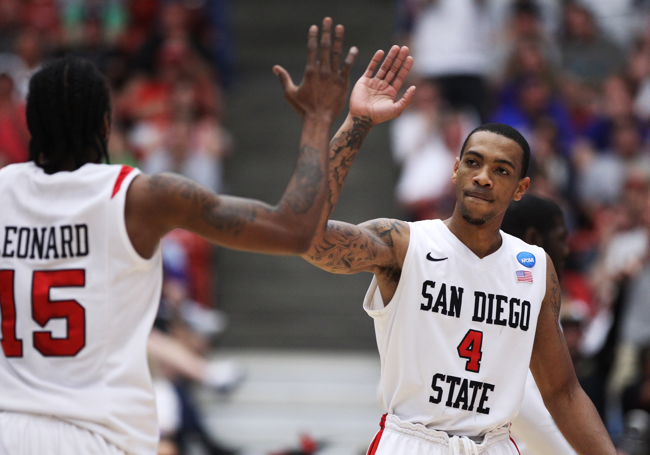 TUCSON, AZ - MARCH 19:  Kawhi Leonard #15 and Malcolm Thomas #4 of the San Diego State Aztecs celebrate during their game against the Temple Owls in the third round of the 2011 NCAA men's basketball tournament at McKale Center on March 19, 2011 in Tucson,