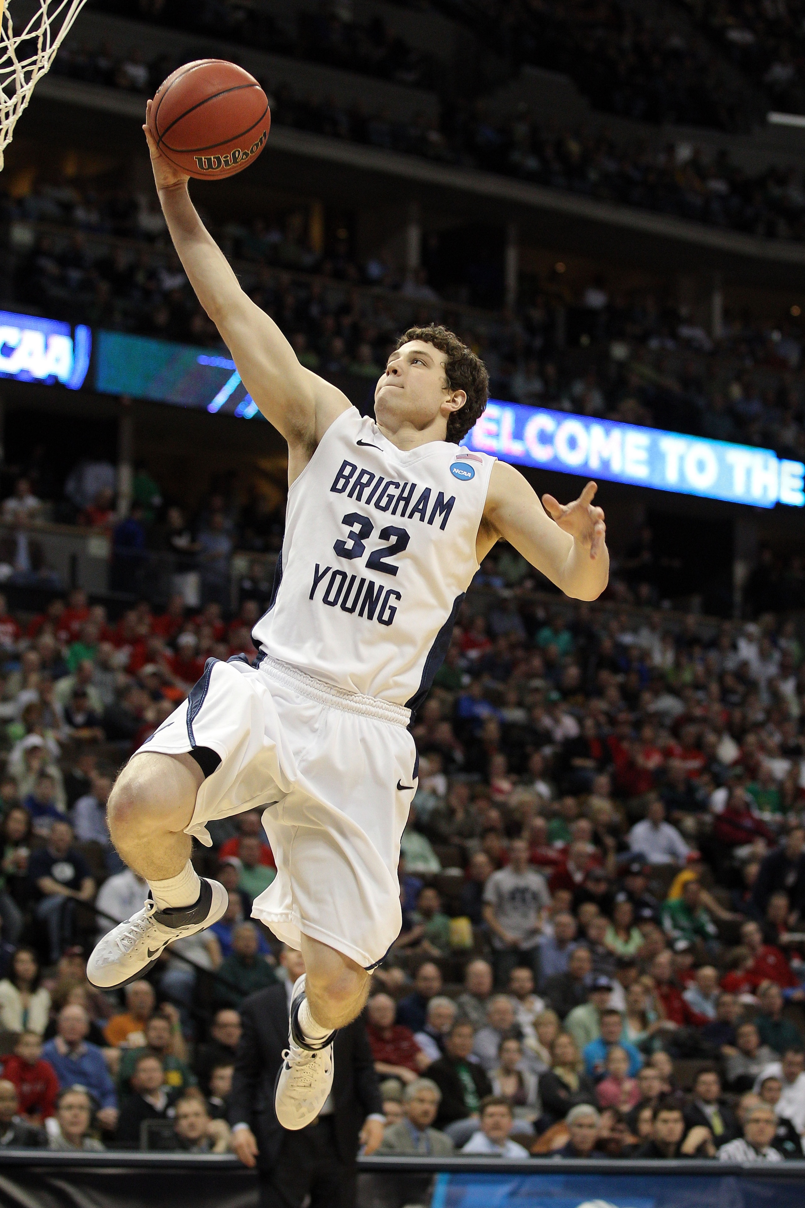 DENVER, CO - MARCH 17:  Jimmer Fredette #32 of the Brigham Young Cougars goes to the hoop for a layup against the Wofford Terriers during the second round of the 2011 NCAA men's basketball tournament at Pepsi Center on March 17, 2011 in Denver, Colorado.