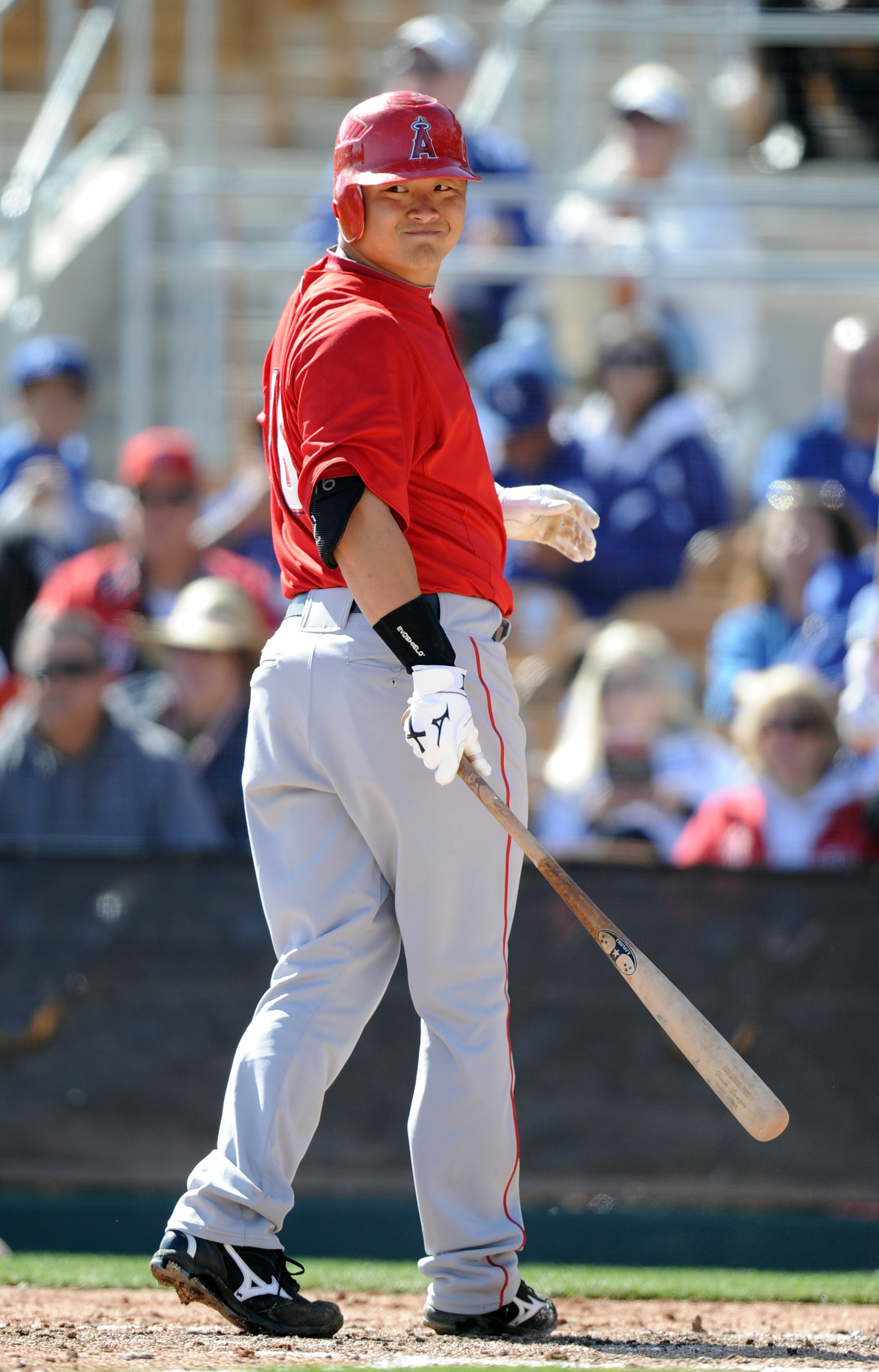 PHOENIX, AZ - FEBRUARY 27:  Hank Conger #16 of the Los Angeles Angels of Anaheim reacts to his strikeout against the Los Angeles Dodgers during spring training at Camelback Ranch on February 27, 2011 in Phoenix, Arizona.  (Photo by Harry How/Getty Images)