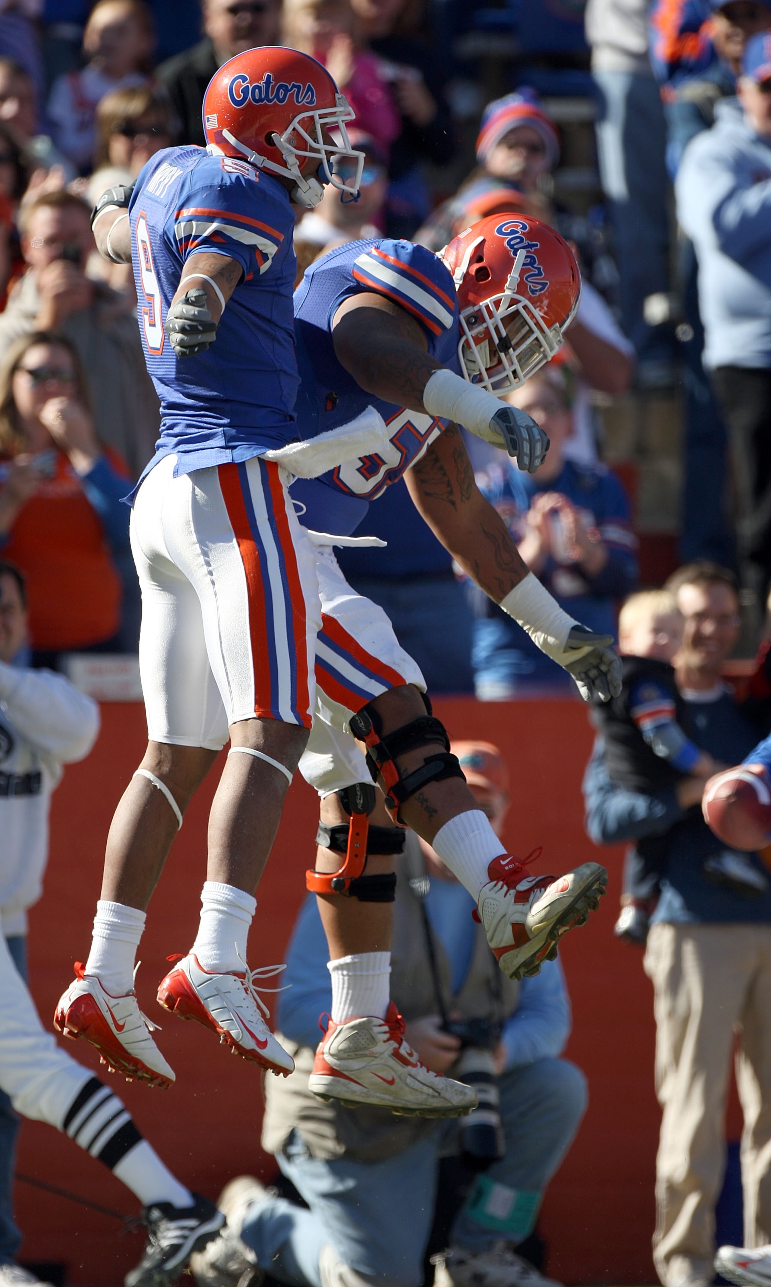 GAINESVILLE, FL - NOVEMBER 22:  Louis Murphy #9 of the Florida Gators celebrates with Mike Pouncey #55 after a touchdown against the Citadel Bulldogs during the game at Ben Hill Griffin Stadium on November 22, 2008 in Gainesville, Florida.  (Photo by Sam