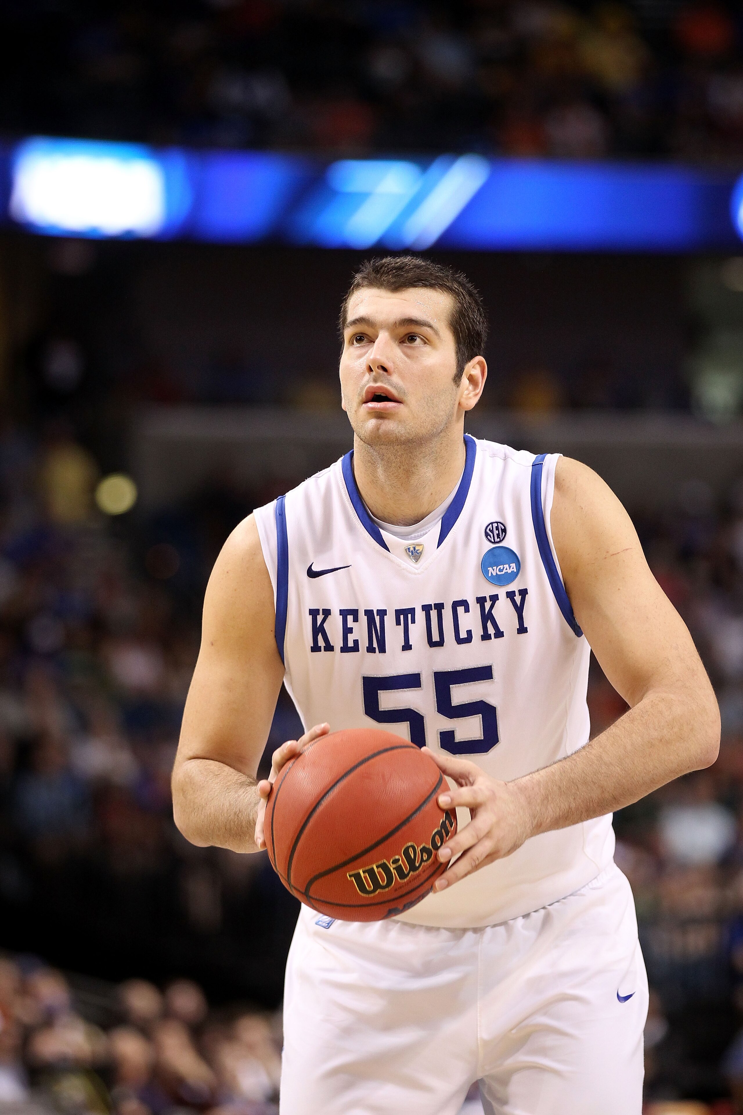 TAMPA, FL - MARCH 19:  Josh Harrellson #55 of the Kentucky Wildcats gets set to shoot a free throw attempt against the West Virginia Mountaineers during the third round of the 2011 NCAA men's basketball tournament at St. Pete Times Forum on March 19, 2011