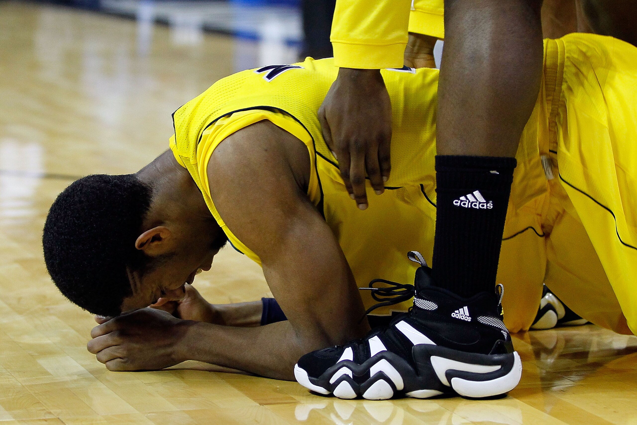 CHARLOTTE, NC - MARCH 20:  Darius Morris #4 of the Michigan Wolverines reacts after missing the tying shot as the Wolverines lose to the Duke Blue Devils 73-71 during the third round of the 2011 NCAA men's basketball tournament at Time Warner Cable Arena