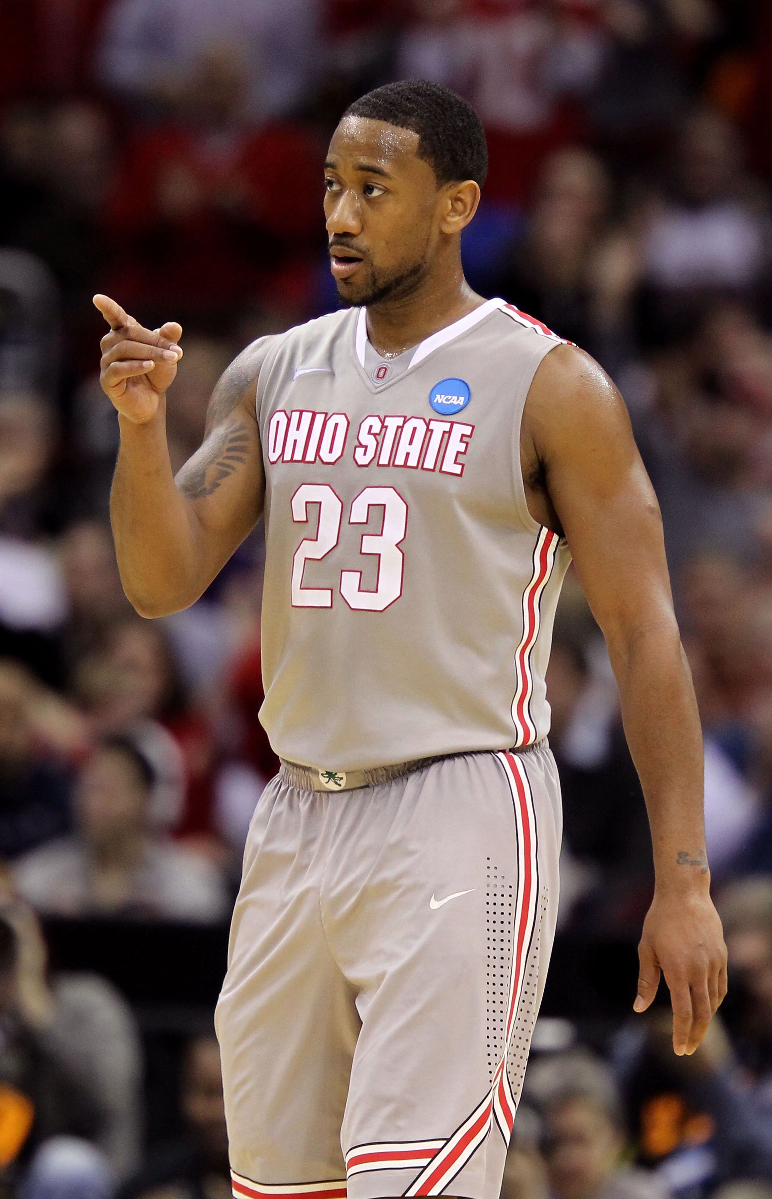 CLEVELAND, OH - MARCH 20: David Lighty #23 of the Ohio State Buckeyes reacts after a play in the second half against the George Mason Patriots during the third of the 2011 NCAA men's basketball tournament at Quicken Loans Arena on March 20, 2011 in Clevel