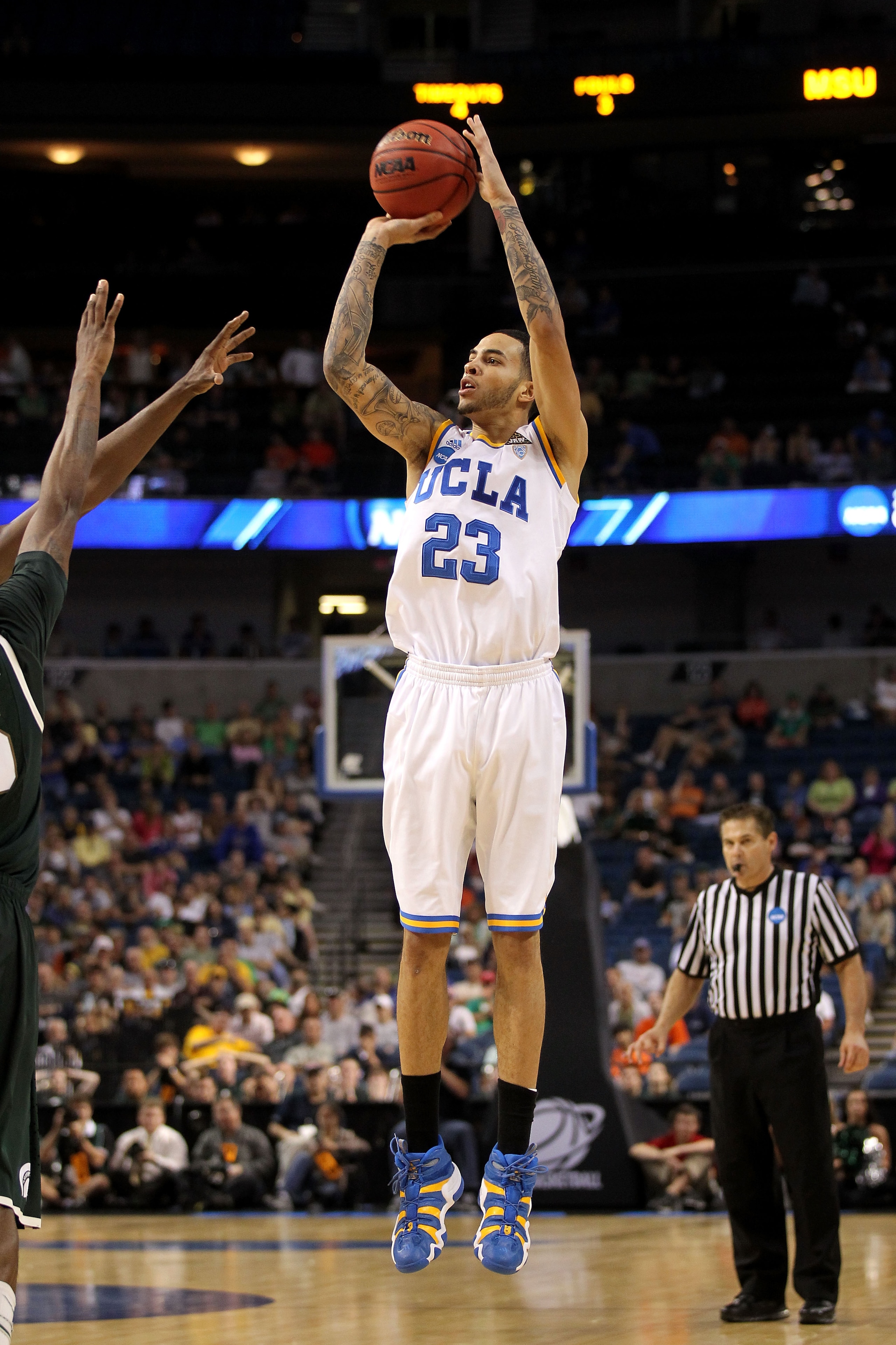 TAMPA, FL - MARCH 17: Tyler Honeycutt #23 of the UCLA Bruins attempts a shot against the Michigan State Spartans during the second round of the 2011 NCAA men's basketball tournament at St. Pete Times Forum on March 17, 2011 in Tampa, Florida. UCLA won 78 TAMPA, FL - MARCH 17: Tyler Honeycutt #23 of the UCLA Bruins attempts a shot against the Michigan State Spartans during the second round of the 2011 NCAA men's basketball tournament at St. Pete Times Forum on March 17, 2011 in Tampa, Florida. UCLA won 78