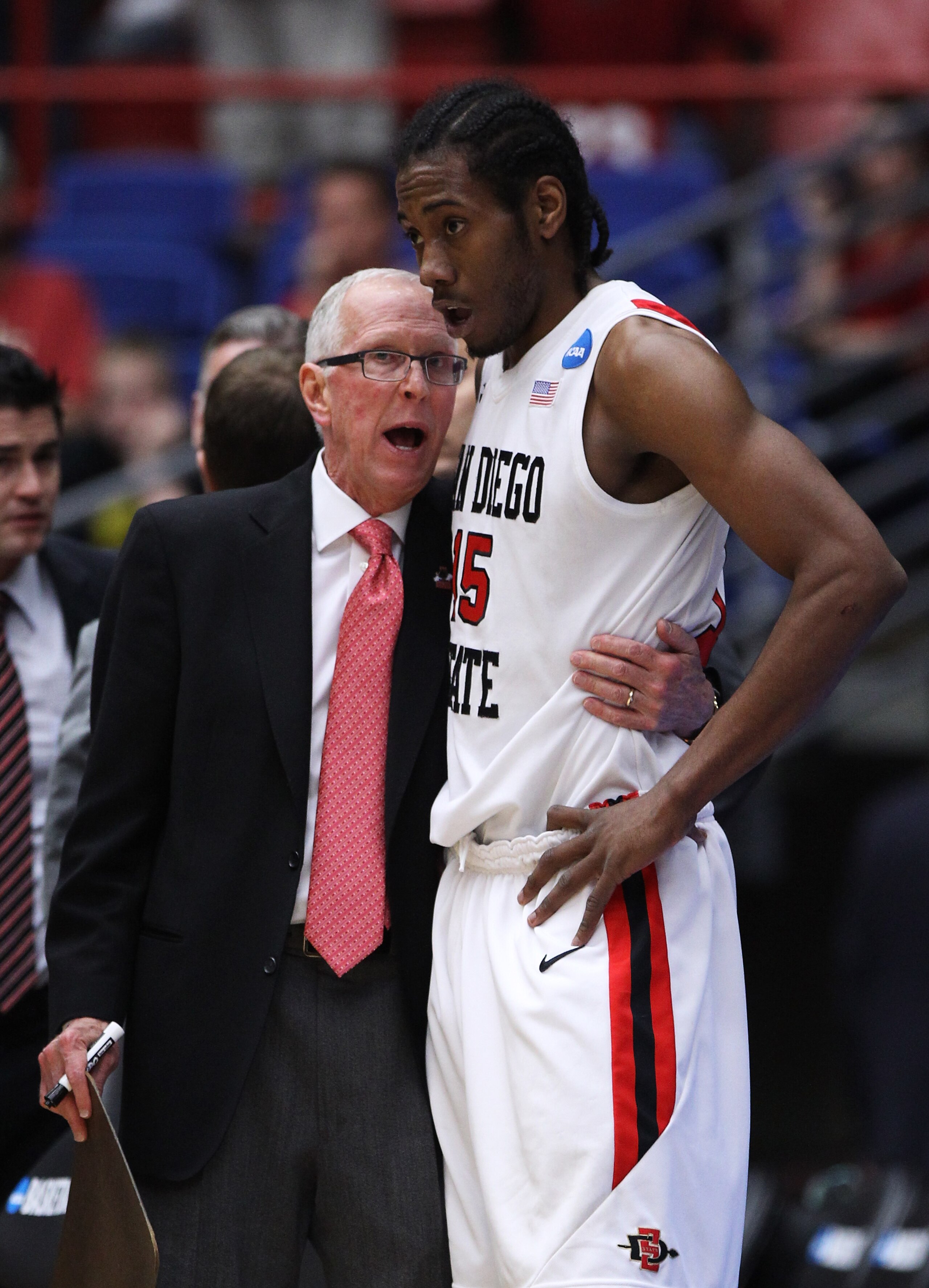 TUCSON, AZ - MARCH 19: Head coach Steve Fisher talks to Kawhi Leonard #15 of the San Diego State Aztecs during their game against the Temple Owls the third round of the 2011 NCAA men's basketball tournament at McKale Center on March 19, 2011 in Tucson, A TUCSON, AZ - MARCH 19: Head coach Steve Fisher talks to Kawhi Leonard #15 of the San Diego State Aztecs during their game against the Temple Owls the third round of the 2011 NCAA men's basketball tournament at McKale Center on March 19, 2011 in Tucson, A