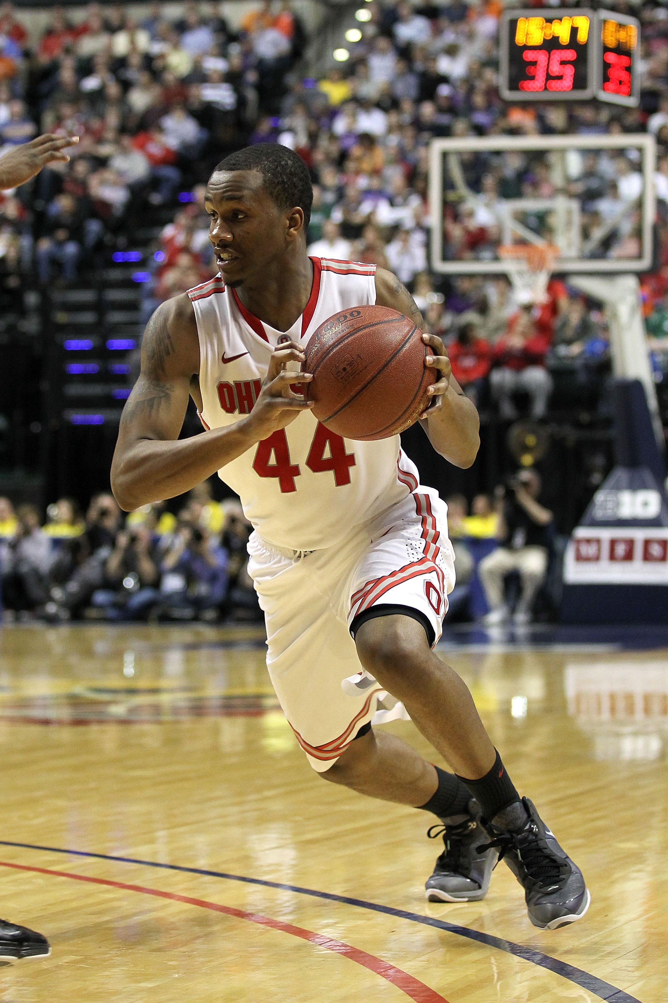 INDIANAPOLIS, IN - MARCH 12:  William Buford #44 of the Ohio State Buckeyes drives against the Michigan Wolverines during the semifinals of the 2011 Big Ten Men's Basketball Tournament at Conseco Fieldhouse on March 12, 2011 in Indianapolis, Indiana. Ohio