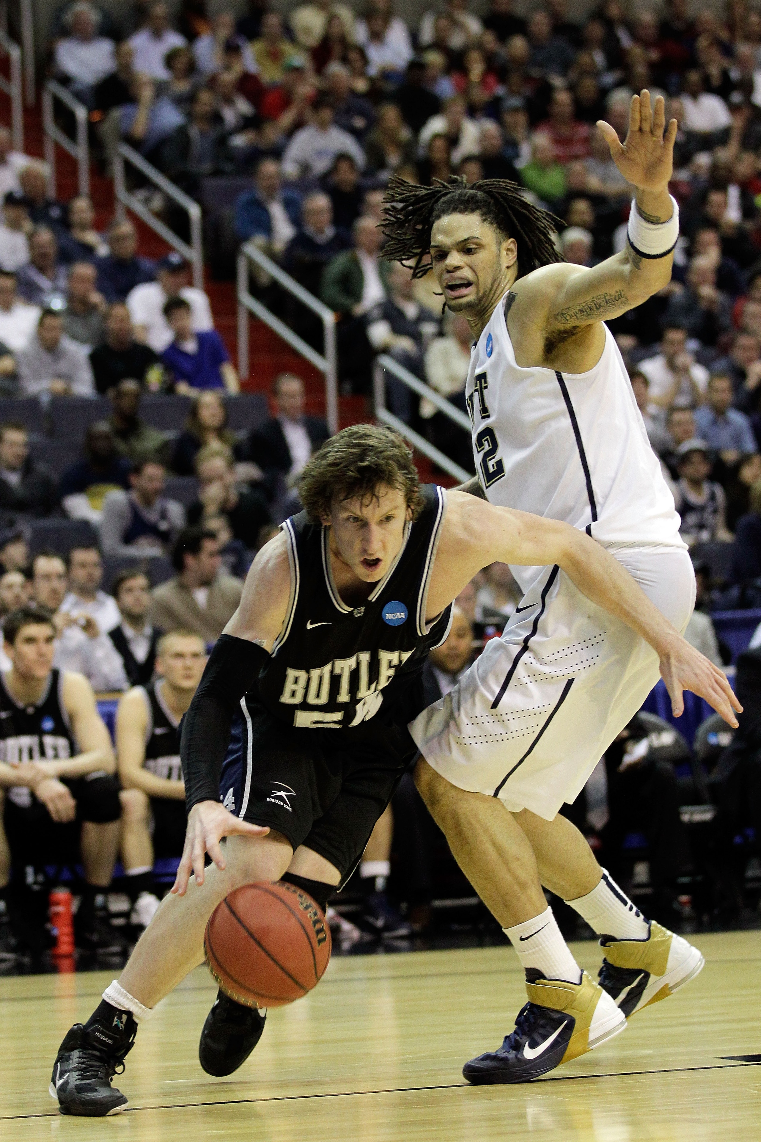 WASHINGTON - MARCH 19: Matt Howard #54 of the Butler Bulldogs drives past Gary McGhee #52 of the Pittsburgh Panthers during the third round of the 2011 NCAA men's basketball tournament at Verizon Center on March 19, 2011 in Washington, DC. (Photo by Rob WASHINGTON - MARCH 19: Matt Howard #54 of the Butler Bulldogs drives past Gary McGhee #52 of the Pittsburgh Panthers during the third round of the 2011 NCAA men's basketball tournament at Verizon Center on March 19, 2011 in Washington, DC. (Photo by Rob
