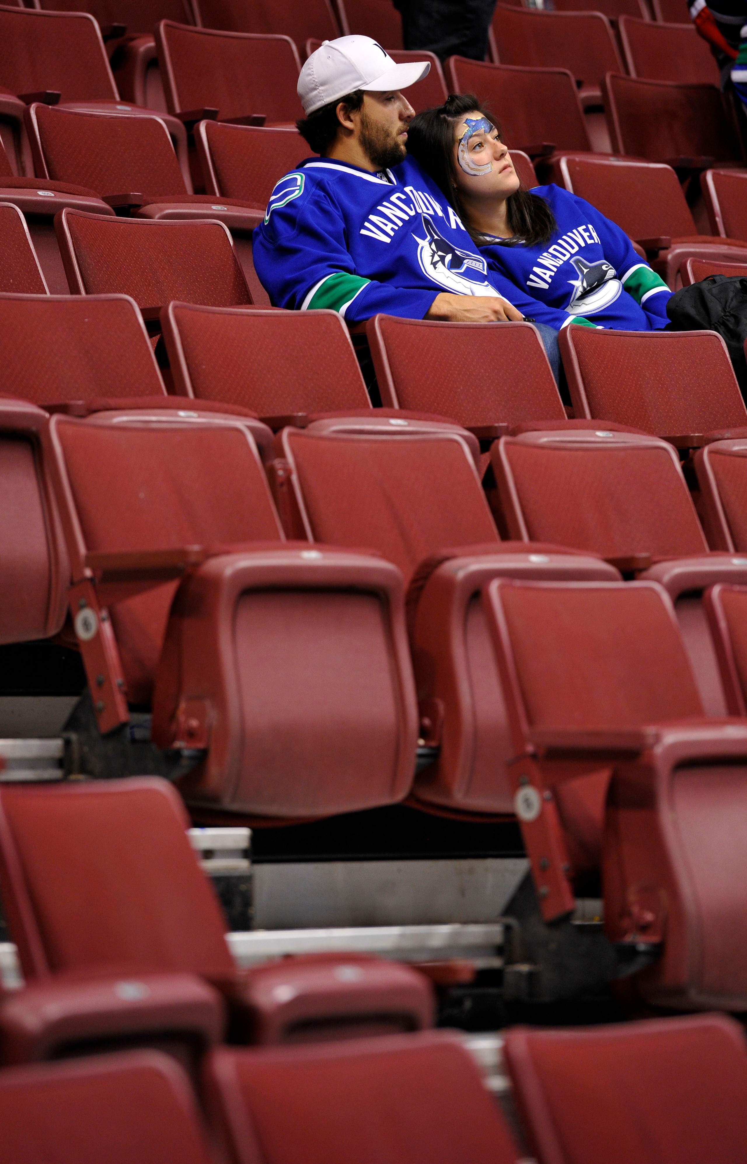 VANCOUVER, CANADA - MAY 11:  A pair of Vancouver Canucks fans sit in the stands after the Canucks lost 5-1 to the Chicago Blackhawks in Game Six of the Western Conference Semifinals and the series 4-2 during the 2010 NHL Stanley Cup Playoffs on May 11, 20