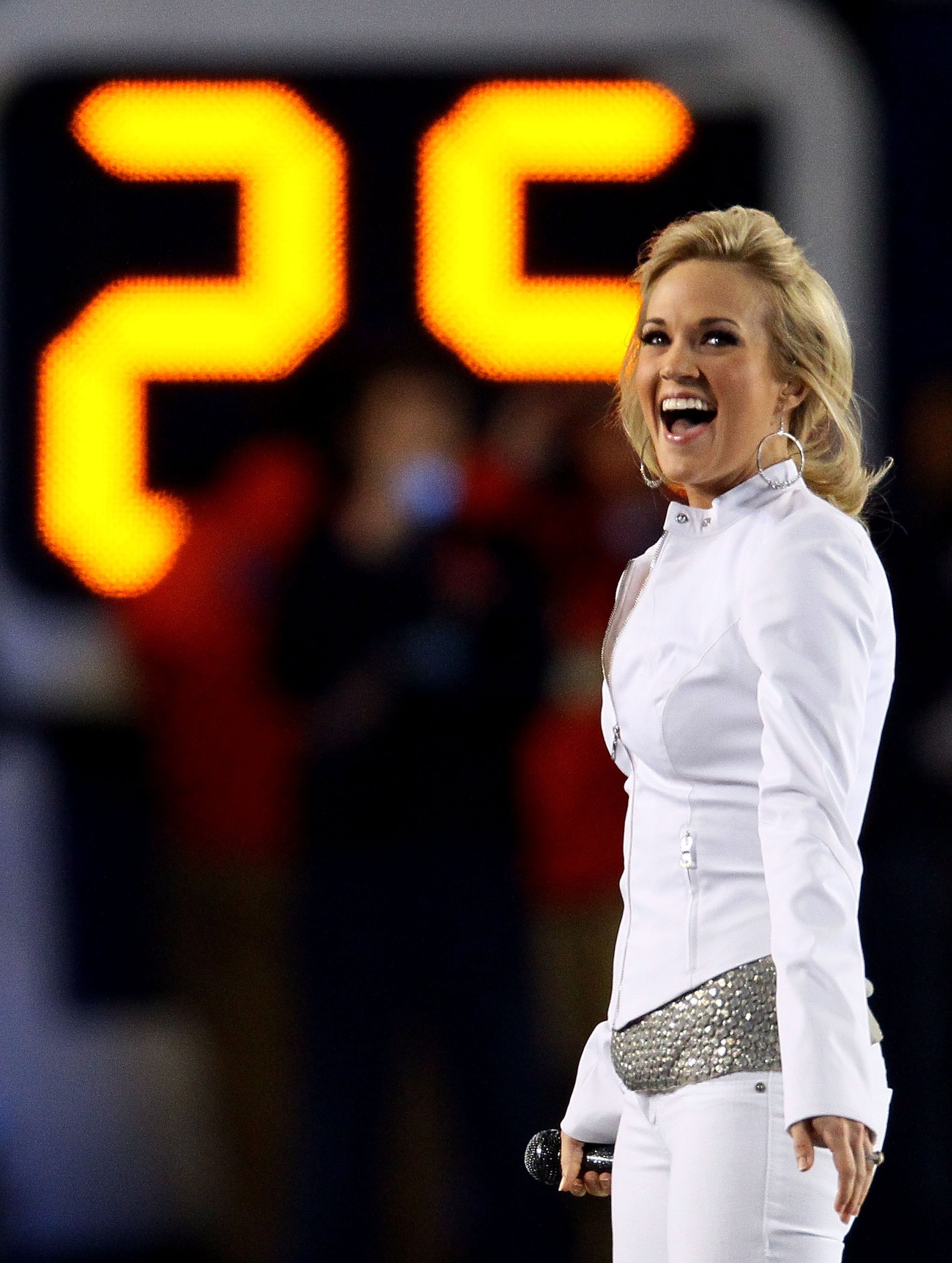 MIAMI GARDENS, FL - FEBRUARY 07:  Singer Carrie Underwood performs during the pregame show prior to Super Bowl XLIV between the Indianapolis Colts and the New Orleans Saints on February 7, 2010 at Sun Life Stadium in Miami Gardens, Florida.  (Photo by Win