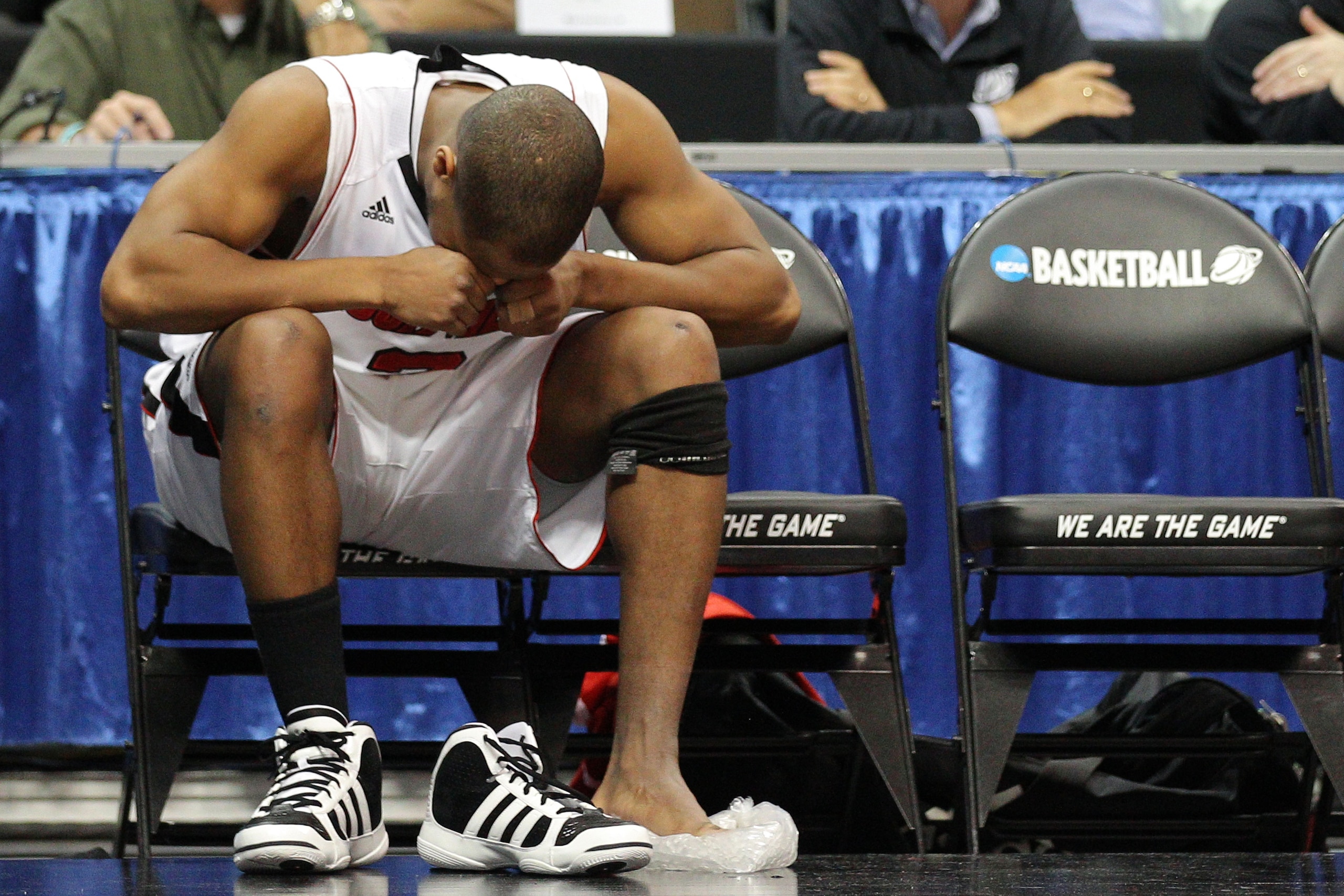 DENVER, CO - MARCH 17:  Preston Knowles #2 of the Louisville Cardinals reacts after coming out of the game because of an injury while playing against the Morehead State Eagles during the second round of the 2011 NCAA men's basketball tournament at Pepsi C