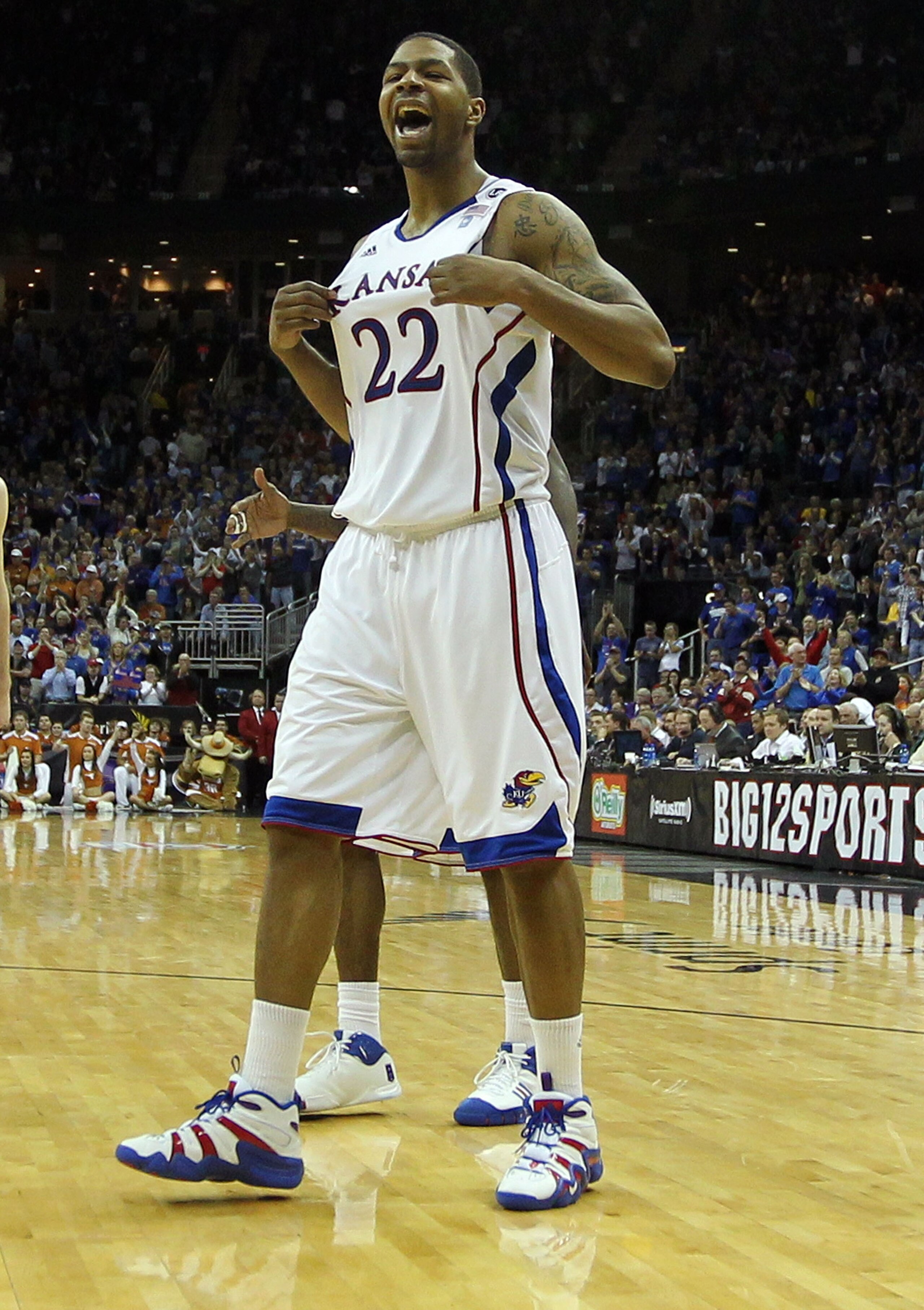 KANSAS CITY, MO - MARCH 12:  Marcus Morris #22 of the Kansas Jayhawks reacts to a play against the Texas Longhorns in the second half of the 2011 Phillips 66 Big 12 Men's Basketball Tournament championship game against the Kansas Jayhawks at Sprint Center