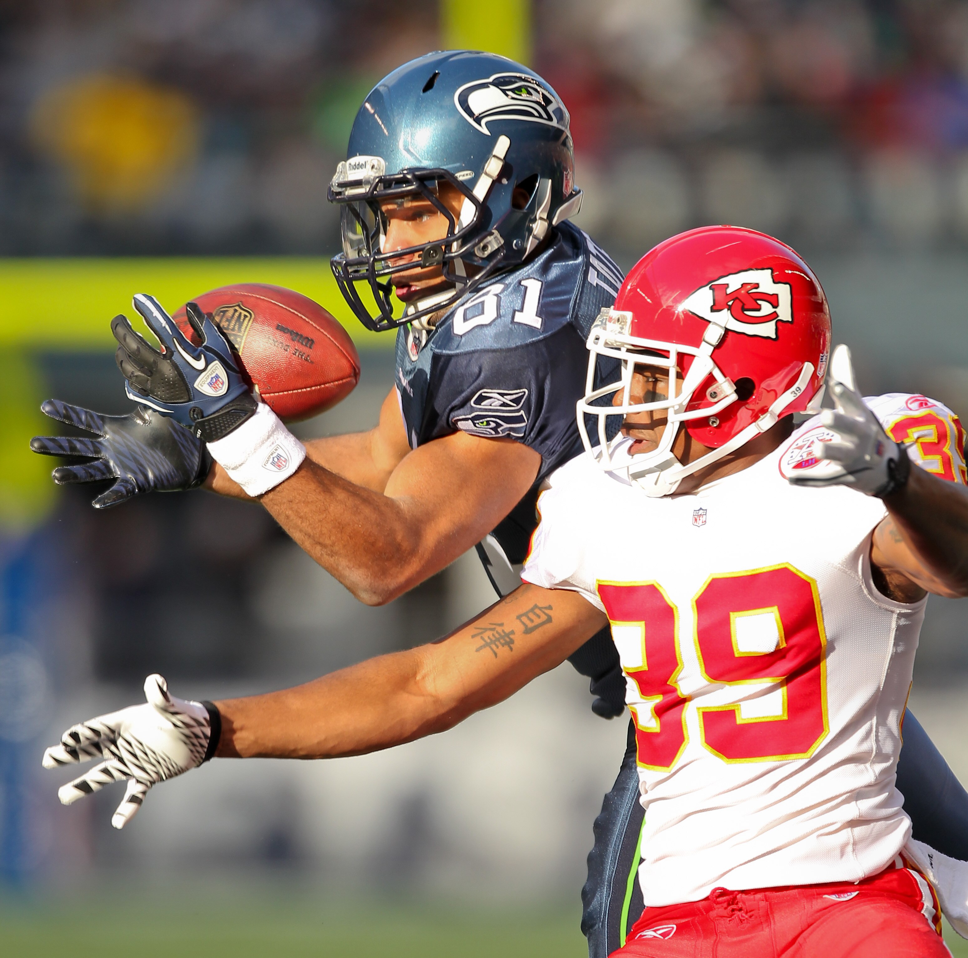 SEATTLE, WA - NOVEMBER 28:  Wide receiver Golden Tate #81 of the Seattle Seahawks attempts to make a catch broken up by Brandon Carr #39 of the Kansas City Chiefs at Qwest Field on November 28, 2010 in Seattle, Washington. (Photo by Otto Greule Jr/Getty I