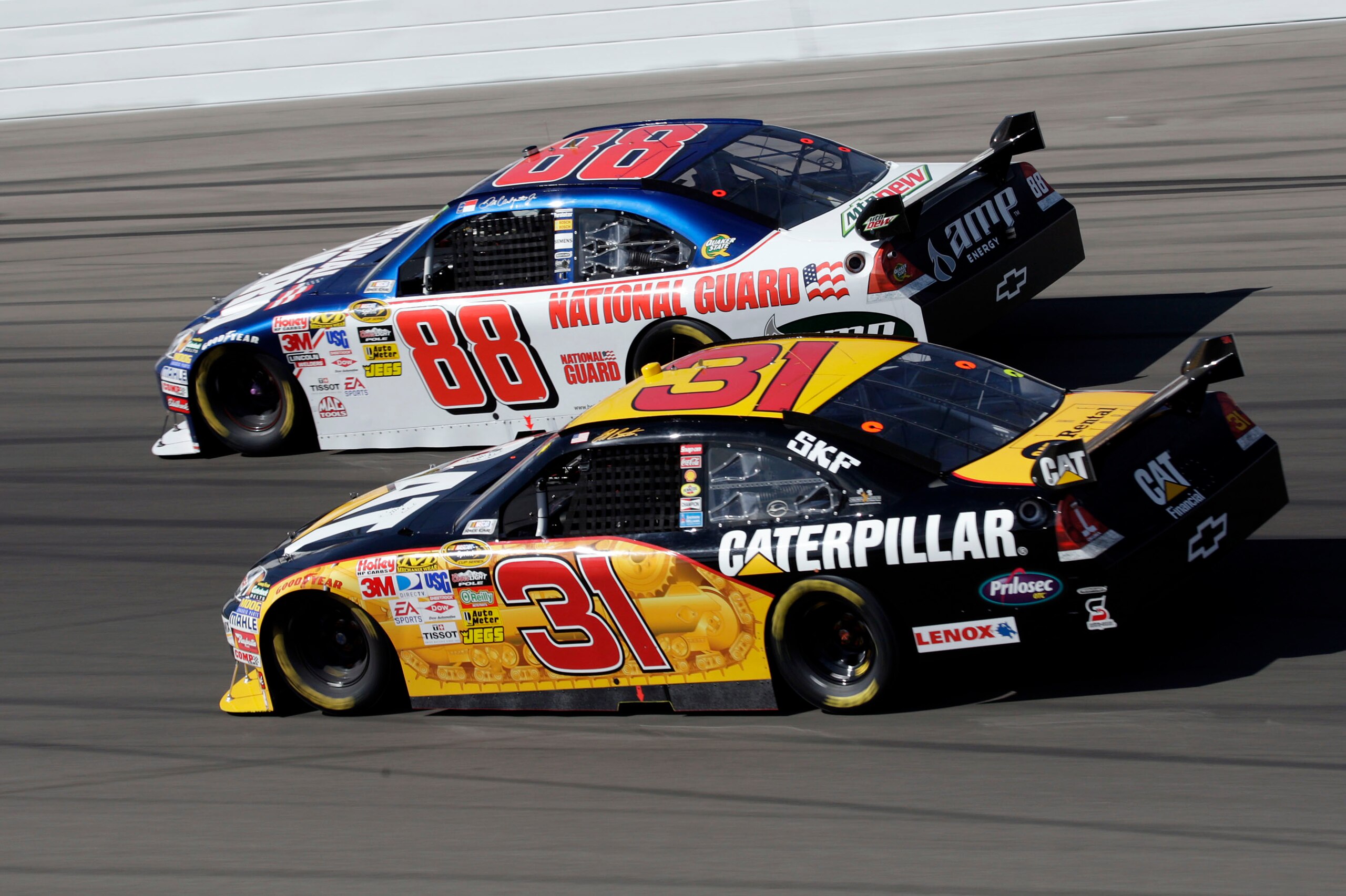 LAS VEGAS - MARCH 01: Dale Earnhardt Jr., driver of the #88 National Guard/AMP Energy Chevrolet, races against Jeff Burton, driver of the #31 Caterpillar Chevrolet, during the NASCAR Sprint Cup Series Shelby 427 at the Las Vegas Motor Speedway on March 1, LAS VEGAS - MARCH 01: Dale Earnhardt Jr., driver of the #88 National Guard/AMP Energy Chevrolet, races against Jeff Burton, driver of the #31 Caterpillar Chevrolet, during the NASCAR Sprint Cup Series Shelby 427 at the Las Vegas Motor Speedway on March 1,