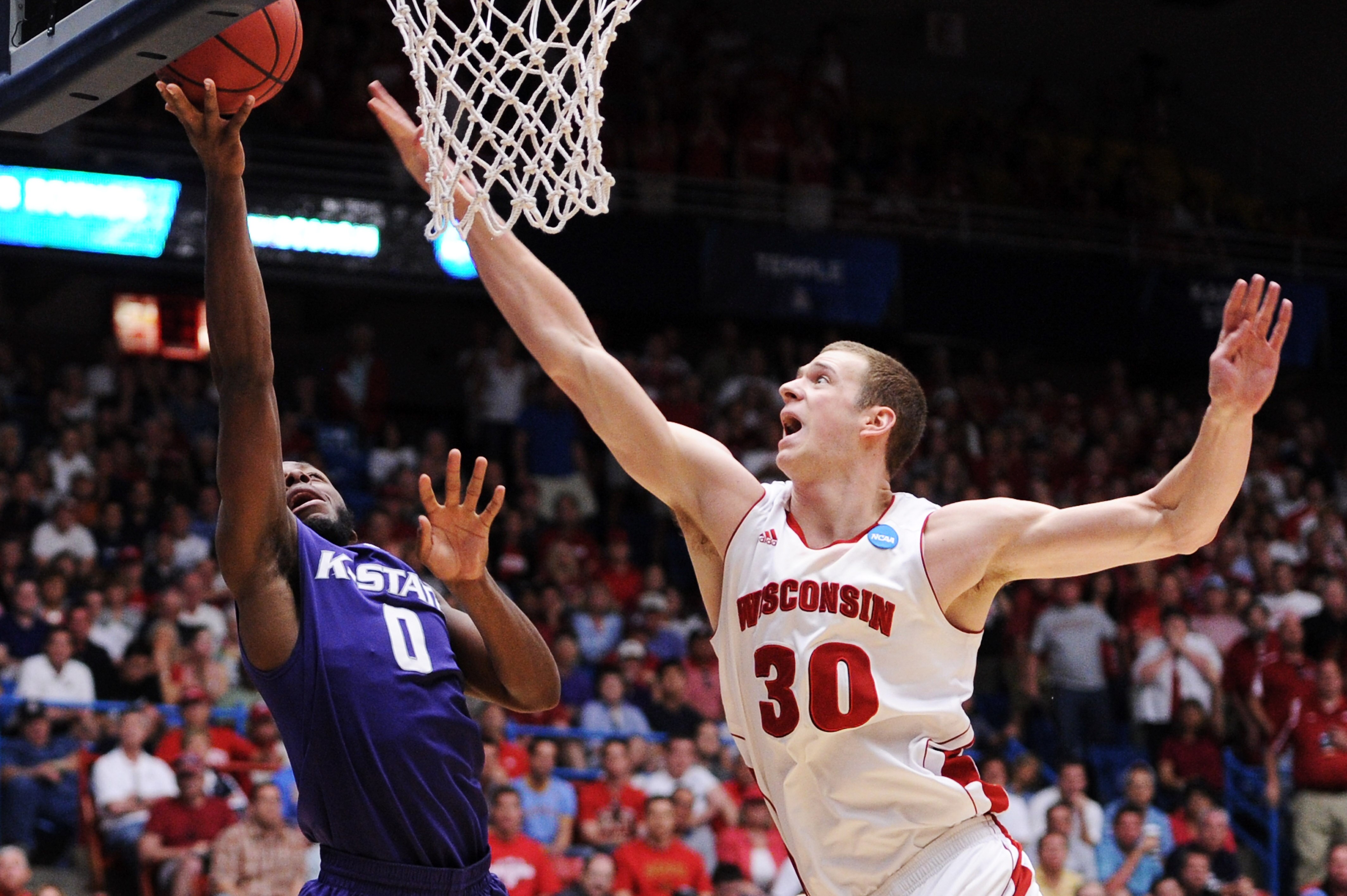 TUCSON, AZ - MARCH 19:  Jacob Pullen #0 of the Kansas State Wildcats shoots against Jon Leuer #30 of the Wisconsin Badgers in the second half during the third round of the 2011 NCAA men's basketball tournament at McKale Center on March 19, 2011 in Tucson,