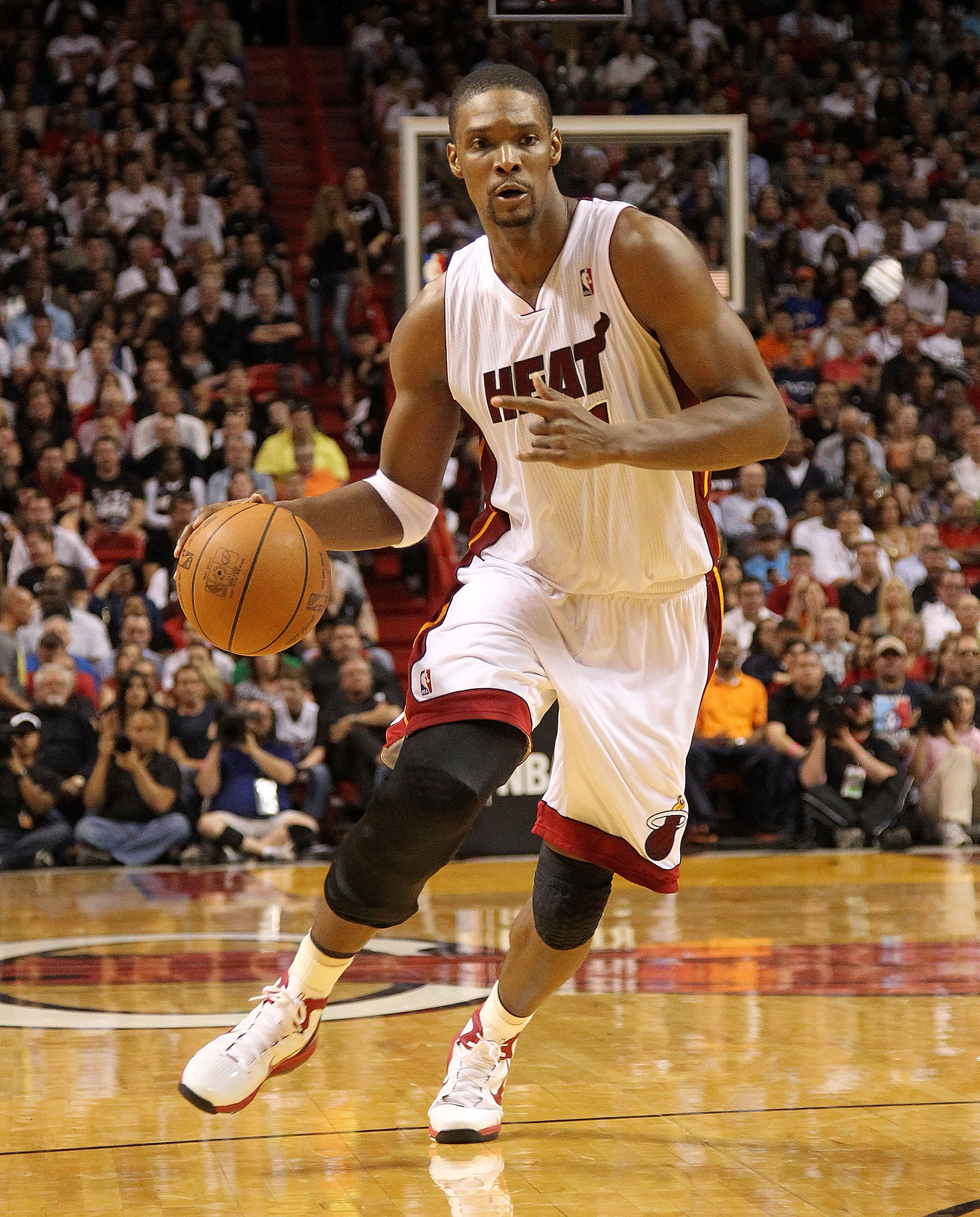 MIAMI, FL - FEBRUARY 27: Chris Bosh #1 of the Miami Heat drives during a game gainst the New York Knicks at American Airlines Arena on February 27, 2011 in Miami, Florida. NOTE TO USER: User expressly acknowledges and agrees that, by downloading and/or us