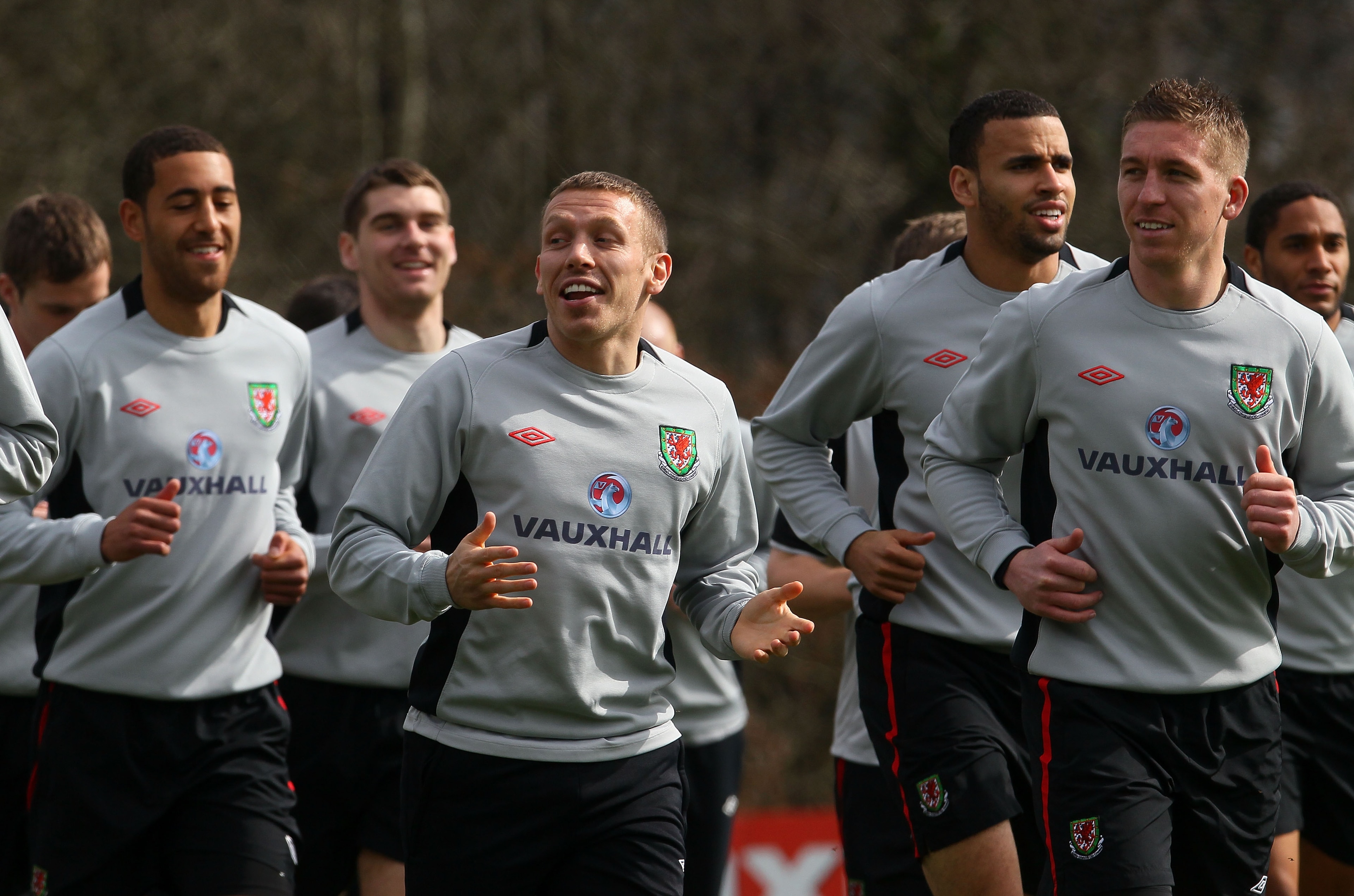 CARDIFF, WALES - MARCH 22:  Wales striker Craig Bellamy (c) shares a joke with team mates during Wales training at the Vale ahead of their UEFA EURO 2012 qualifier against England, on March 22, 2011 in Cardiff, Wales.  (Photo by Stu Forster/Getty Images)
