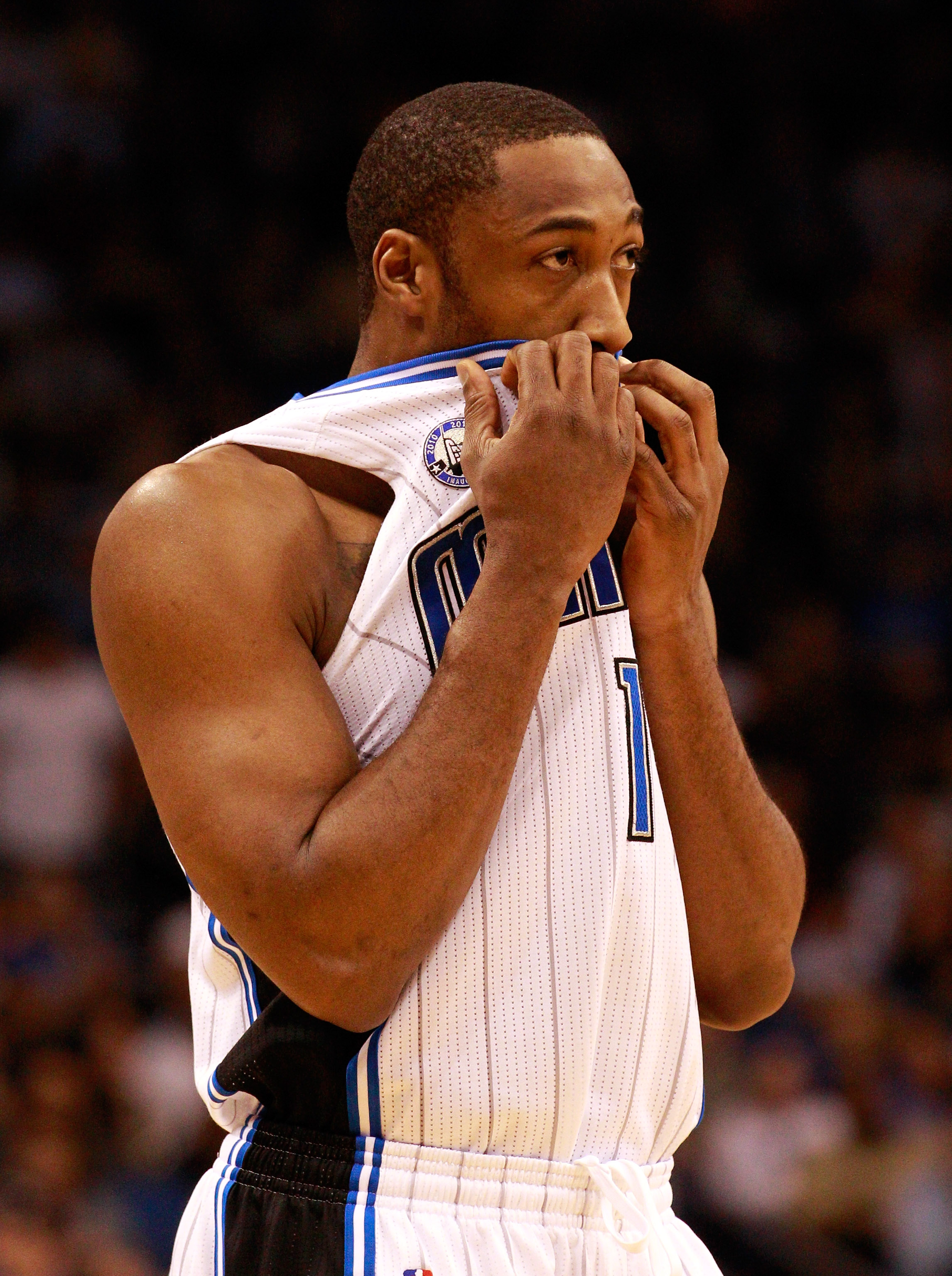 ORLANDO, FL - FEBRUARY 13:  Gilbert Arenas #1 of the Orlando Magic covers his mouth during the game against the Los Angeles Lakers at Amway Arena on February 13, 2011 in Orlando, Florida.  NOTE TO USER: User expressly acknowledges and agrees that, by down