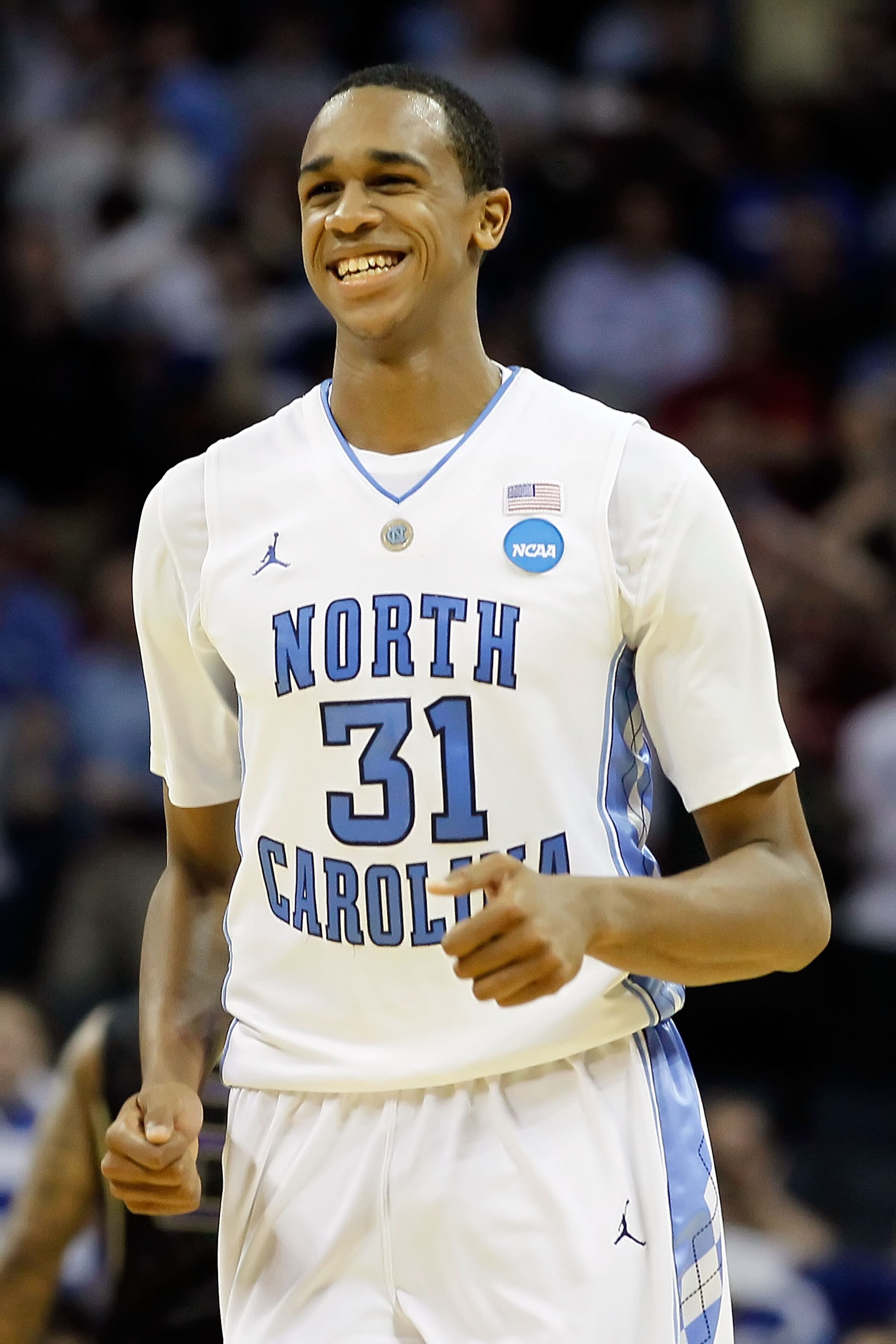 CHARLOTTE, NC - MARCH 20:  John Henson #31 of the North Carolina Tar Heels reacts after blocking the inbounds pass late in the second half before the Tar Heels defeated the Washington Huskies 86-83 during the third round of the 2011 NCAA men's basketball 