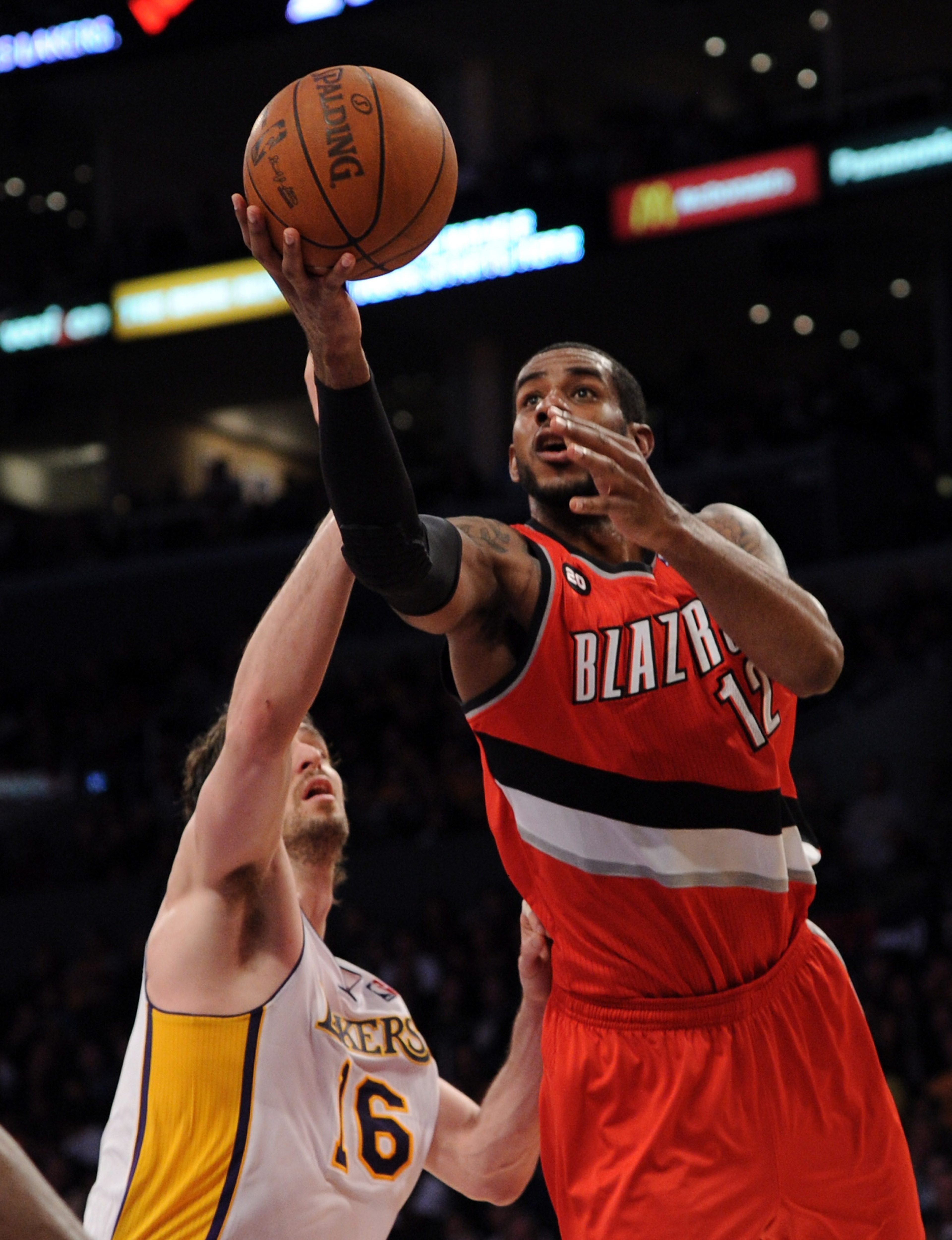 LOS ANGELES, CA - MARCH 20:  LaMarcus Aldridge #12 of the Portland Trail Blazers goes in for a layup in front of Pau Gasol #16 of the Los Angeles Lakers at the Staples Center on March 20, 2011 in Los Angeles, California.  NOTE TO USER: User expressly ackn