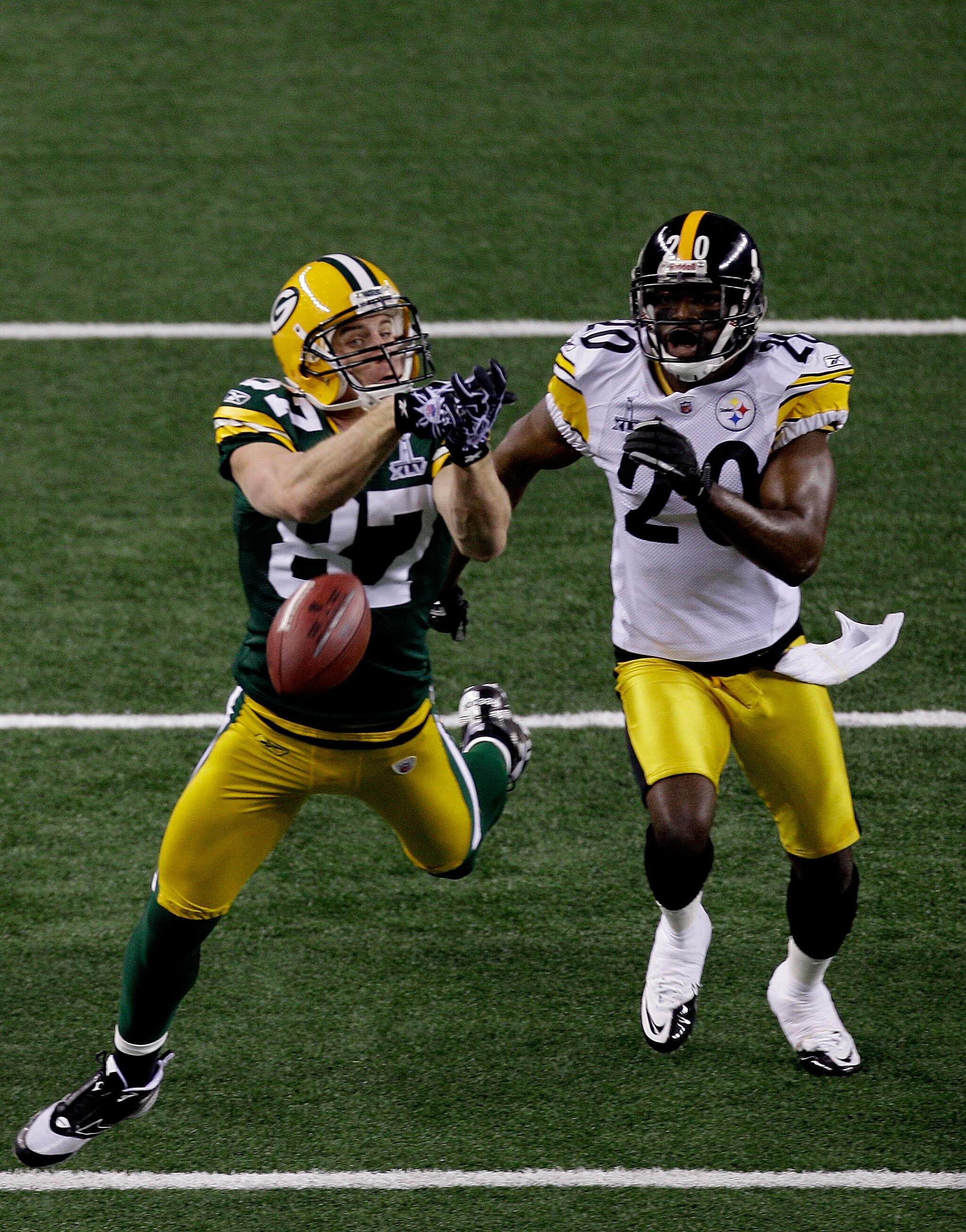 ARLINGTON, TX - FEBRUARY 06:  Jordy Nelson #87 of the Green Bay Packers attempts to catch a pass against Bryant McFadden #20 of the Pittsburgh Steelers during Super Bowl XLV at Cowboys Stadium on February 6, 2011 in Arlington, Texas.  (Photo by Rob Carr/G