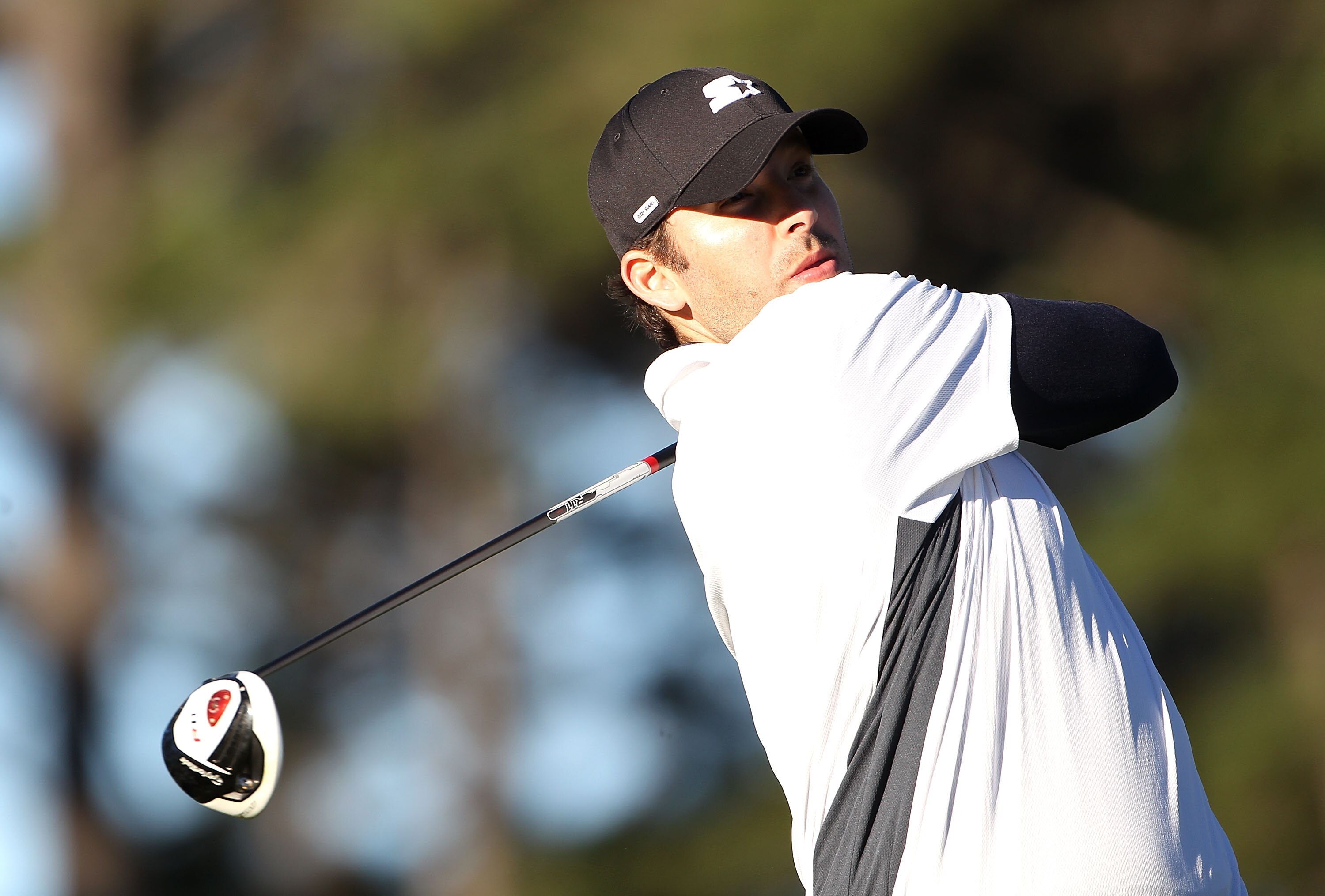 PEBBLE BEACH, CA - FEBRUARY 11:  Professional football player Tony Romo hits from the 10th tee box at the AT&T Pebble Beach National Pro-Am- Round Two at the Spyglass golf club on February 11, 2011 in Pebble Beach, California.  (Photo by Jed Jacobsohn/Get