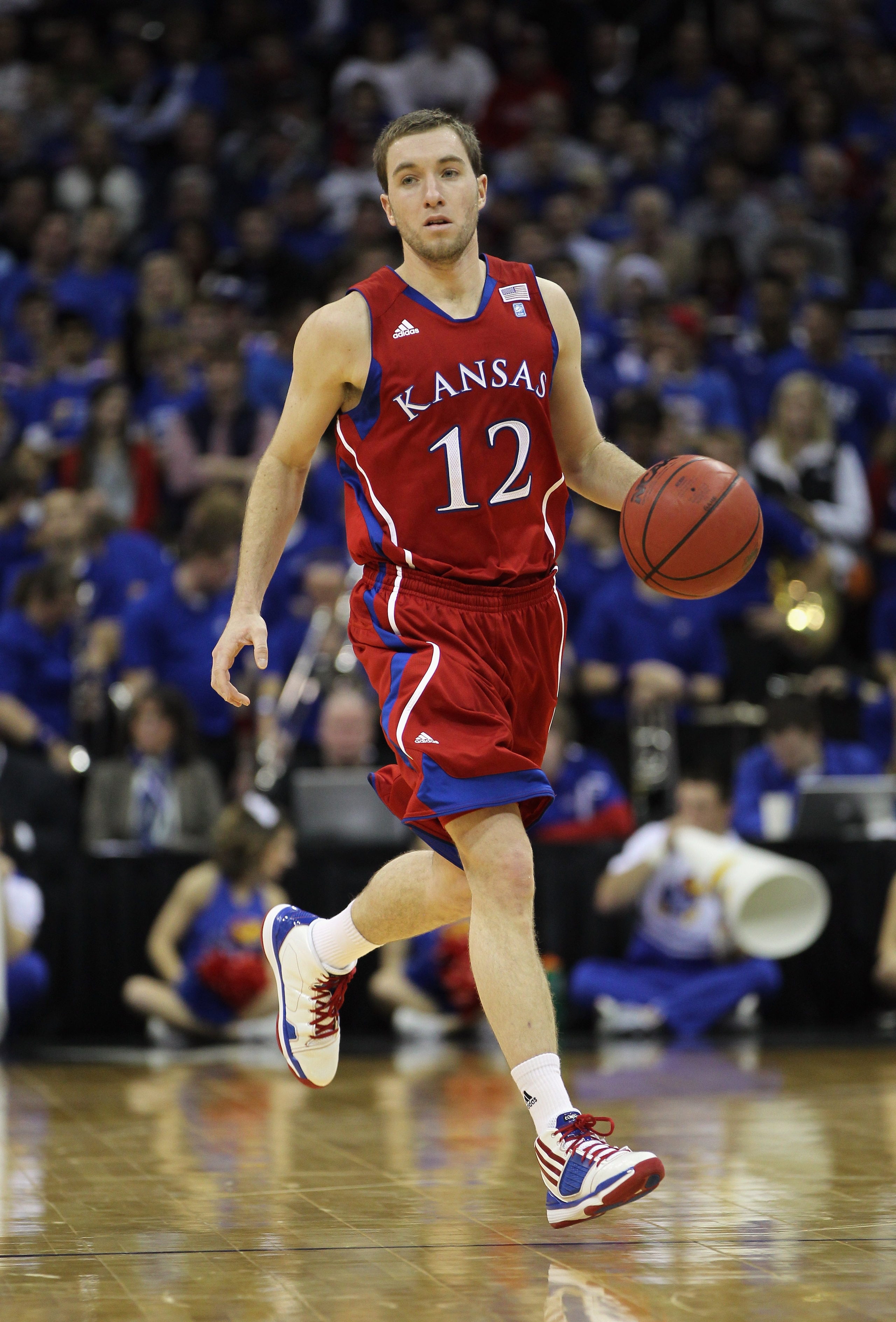 KANSAS CITY, MO - DECEMBER 11:  Brady Morningstar #12 of the Kansas Jayhawks in action during the game against the Colorado State Rams on December 11, 2010 at the Sprint Center in Kansas City, Missouri.  (Photo by Jamie Squire/Getty Images)
