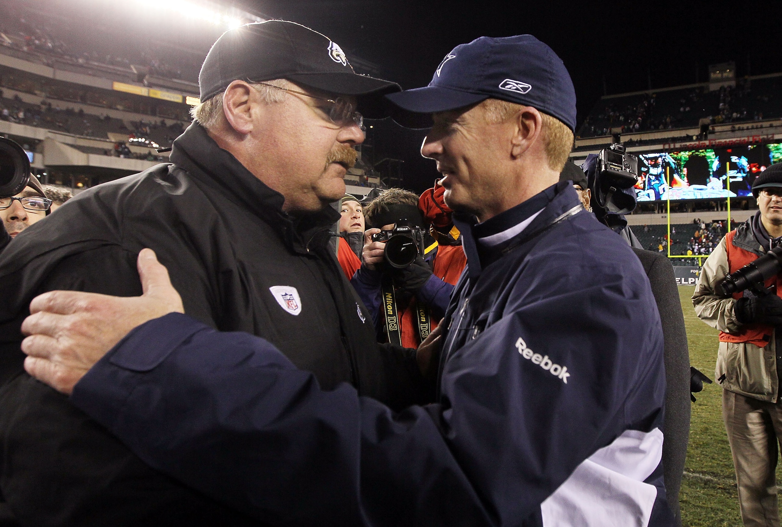 PHILADELPHIA, PA - JANUARY 02: Head coach Andy Reid of the Philadelphia Eagles meets with head coach Jason Garrett of the Dallas Cowboys after their game on January 2, 2011 at Lincoln Financial Field in Philadelphia, Pennsylvania. The Cowboys defeated the