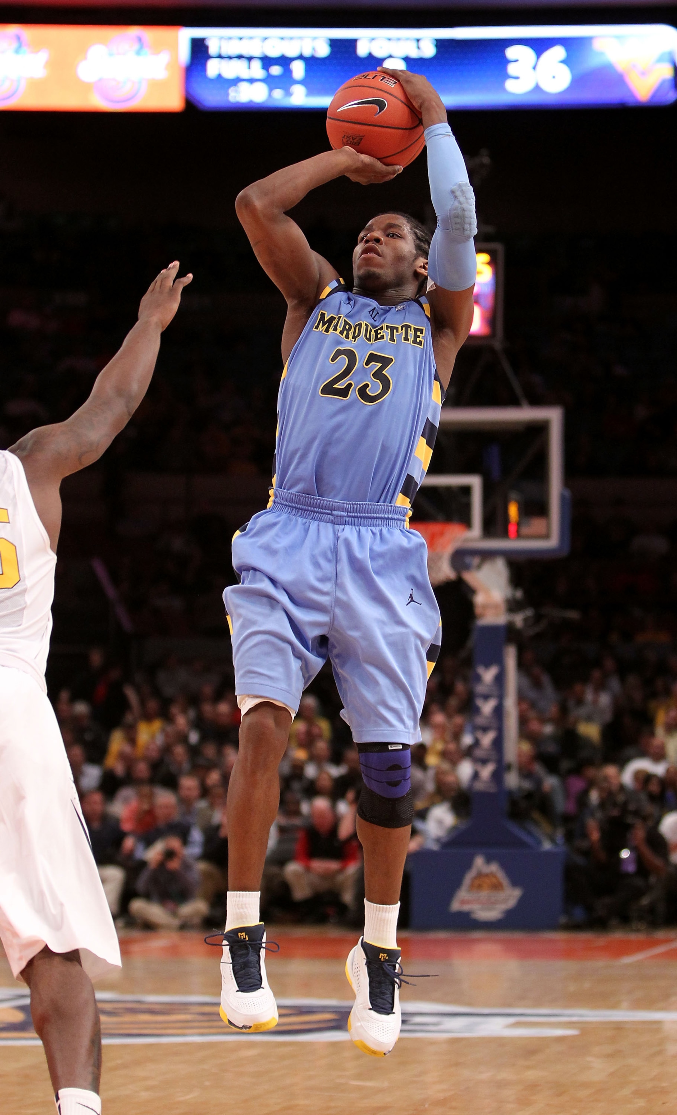 NEW YORK, NY - MARCH 09: Dwight Buycks #23 of the Marquette Golden Eagles shoots a jump shot against the West Virginia Mountaineers during the second round of the 2011 Big East Men's Basketball Tournament presented by American Eagle Outfitters at Madison