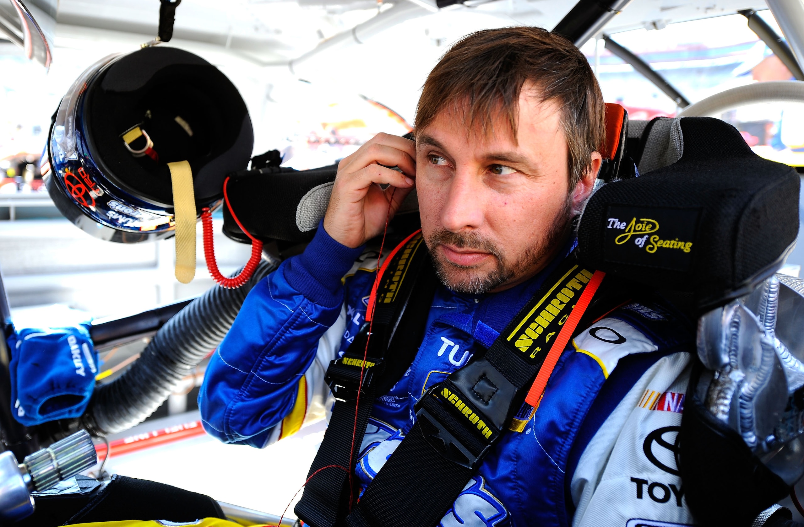 BRISTOL, TN - MARCH 19: David Reutimann, driver of the #00 Aaron's Dream Machine Toyota, sits in his car during practice for the NASCAR Sprint Cup Series Jeff Byrd 500 Presented By Food City at Bristol Motor Speedway on March 19, 2011 in Bristol, Tenness BRISTOL, TN - MARCH 19: David Reutimann, driver of the #00 Aaron's Dream Machine Toyota, sits in his car during practice for the NASCAR Sprint Cup Series Jeff Byrd 500 Presented By Food City at Bristol Motor Speedway on March 19, 2011 in Bristol, Tenness