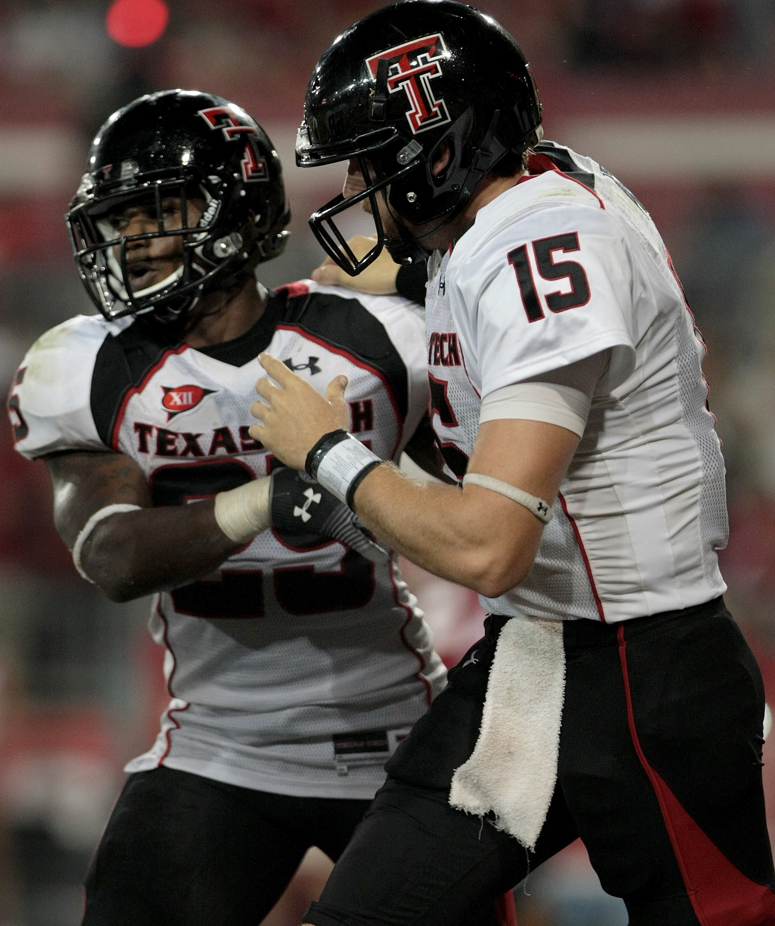 HOUSTON - SEPTEMBER 26: Quarterback Taylor Potts #15 congratulates running back Baron Batch #25 of the Texas Tech Red Raiders for scoring a touchdown against the Houston Cougars at Robertson Stadium on September 26, 2009 in Houston, Texas.  (Photo by Thom