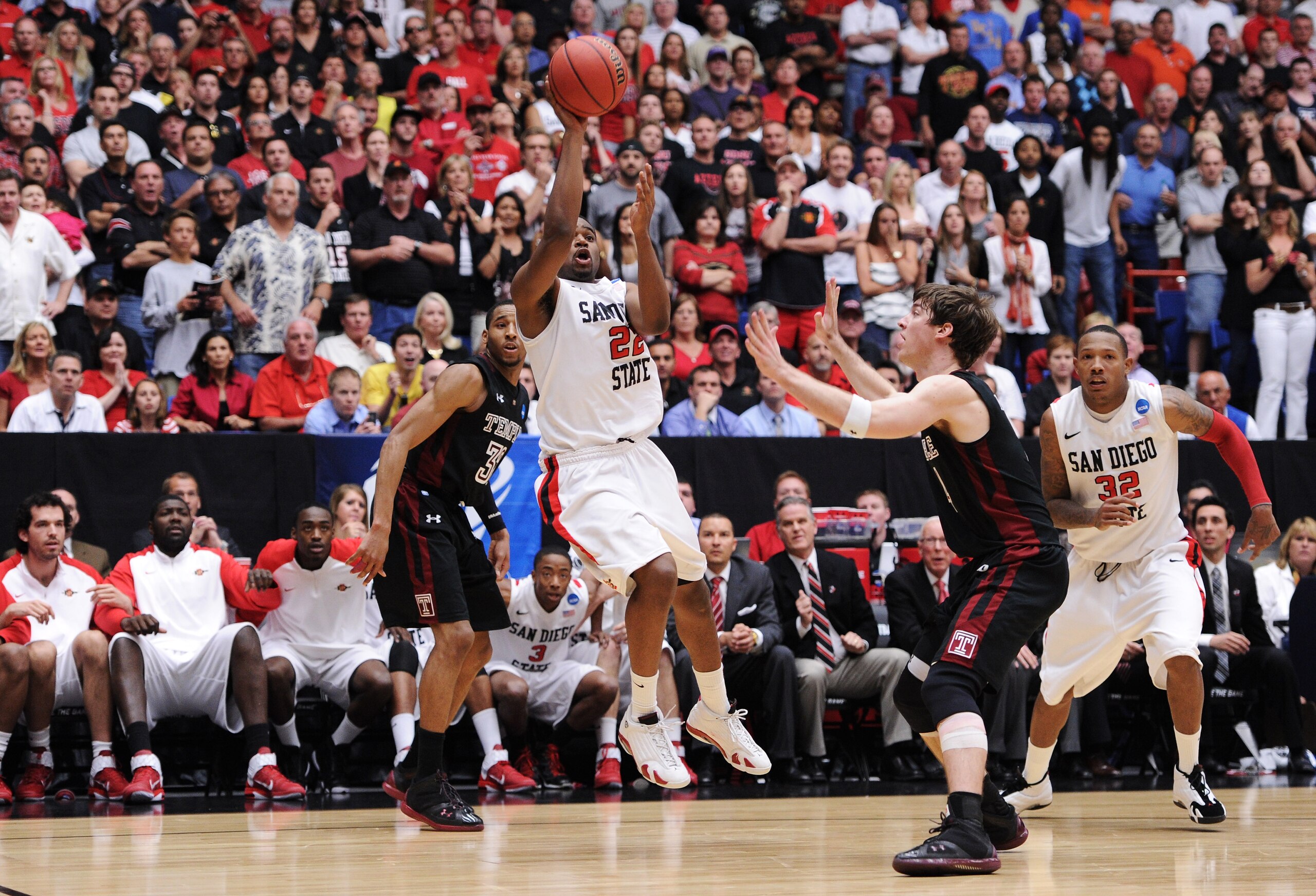TUCSON, AZ - MARCH 19:  Chase Tapley #22 of the San Diego State Aztecs misses a shot against the Temple Owls in the final seconds of the second half sending the game into overtime during the third round of the 2011 NCAA men's basketball tournament at McKa