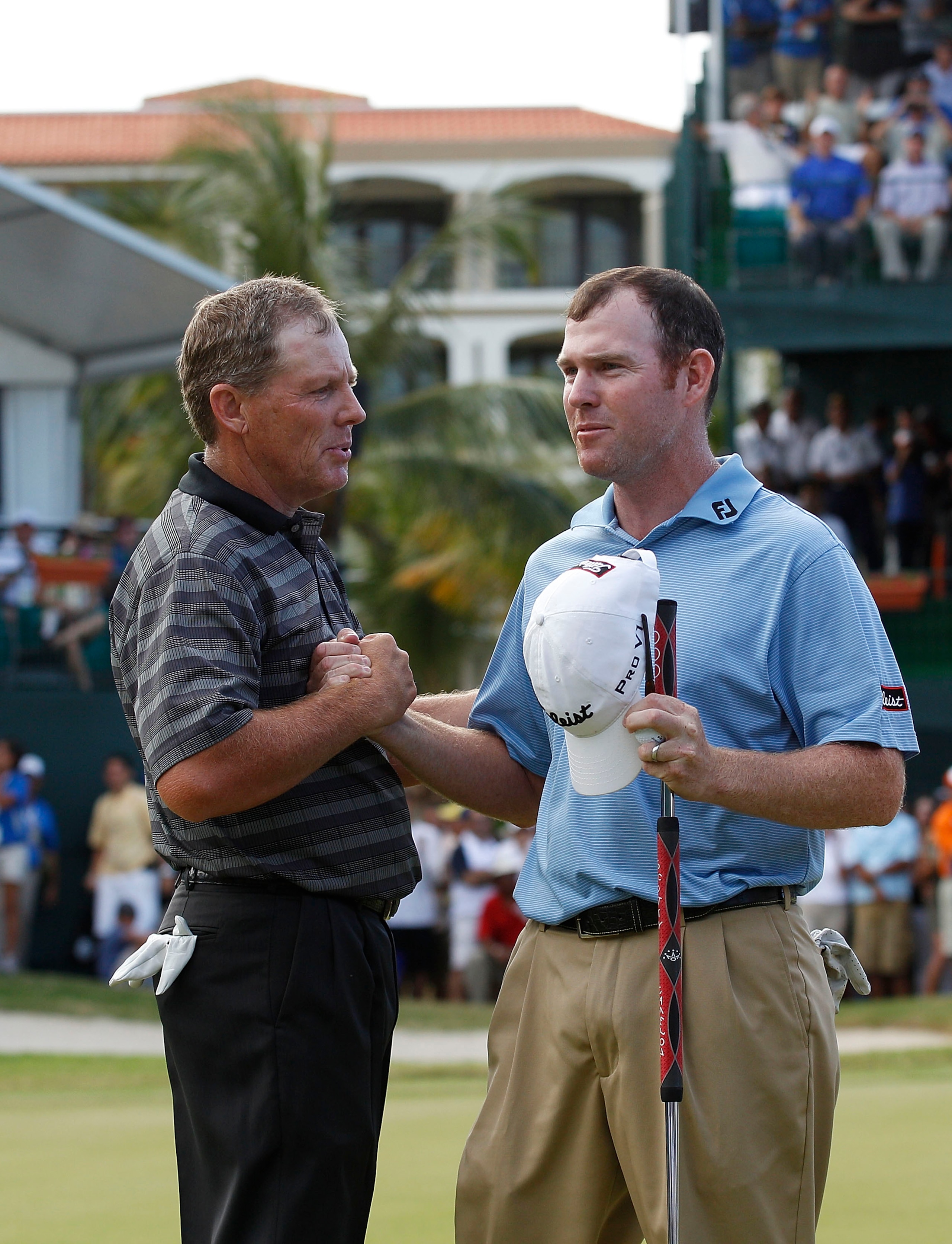 RIO GRANDE, PR - MARCH 13:  Michael Bradley (L) shakes hands with Troy Matteson whom he beat in a one hole playoff to win the Puerto Rico Open presented by seepuertorico.com at Trump International Golf Club on March 13, 2011 in Rio Grande, Puerto Rico.  (