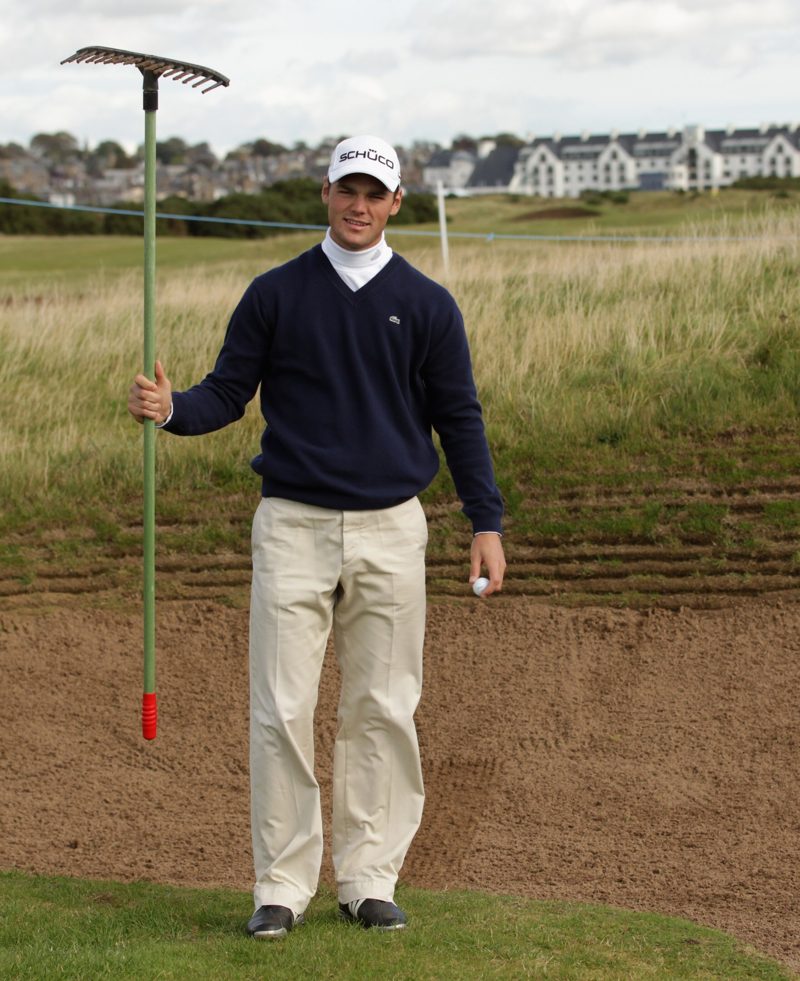 CARNOUSTIE, SCOTLAND - OCTOBER 06:  Martin Kaymer of Germany holds a bunker rake during a practice round for The Alfred Dunhill Links Championship at Carnoustie Golf Links on October 6, 2010 in Carnoustie, Scotland.  (Photo by Andrew Redington/Getty Image