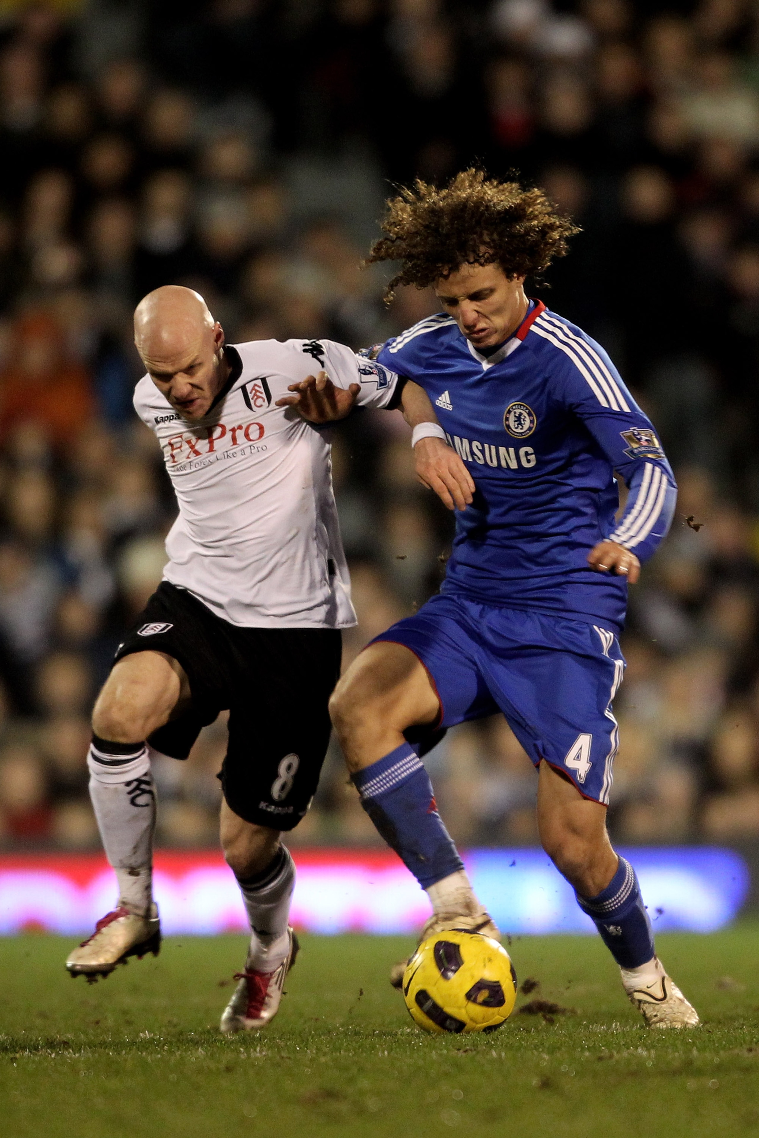 LONDON, ENGLAND - FEBRUARY 14:  David Luiz of Chelsea fights for the ball with Andrew Johnson of Fulham during the Barclays Premier League match between Fulham and Chelsea at Craven Cottage on February 14, 2011 in London, England.  (Photo by Scott Heavey/