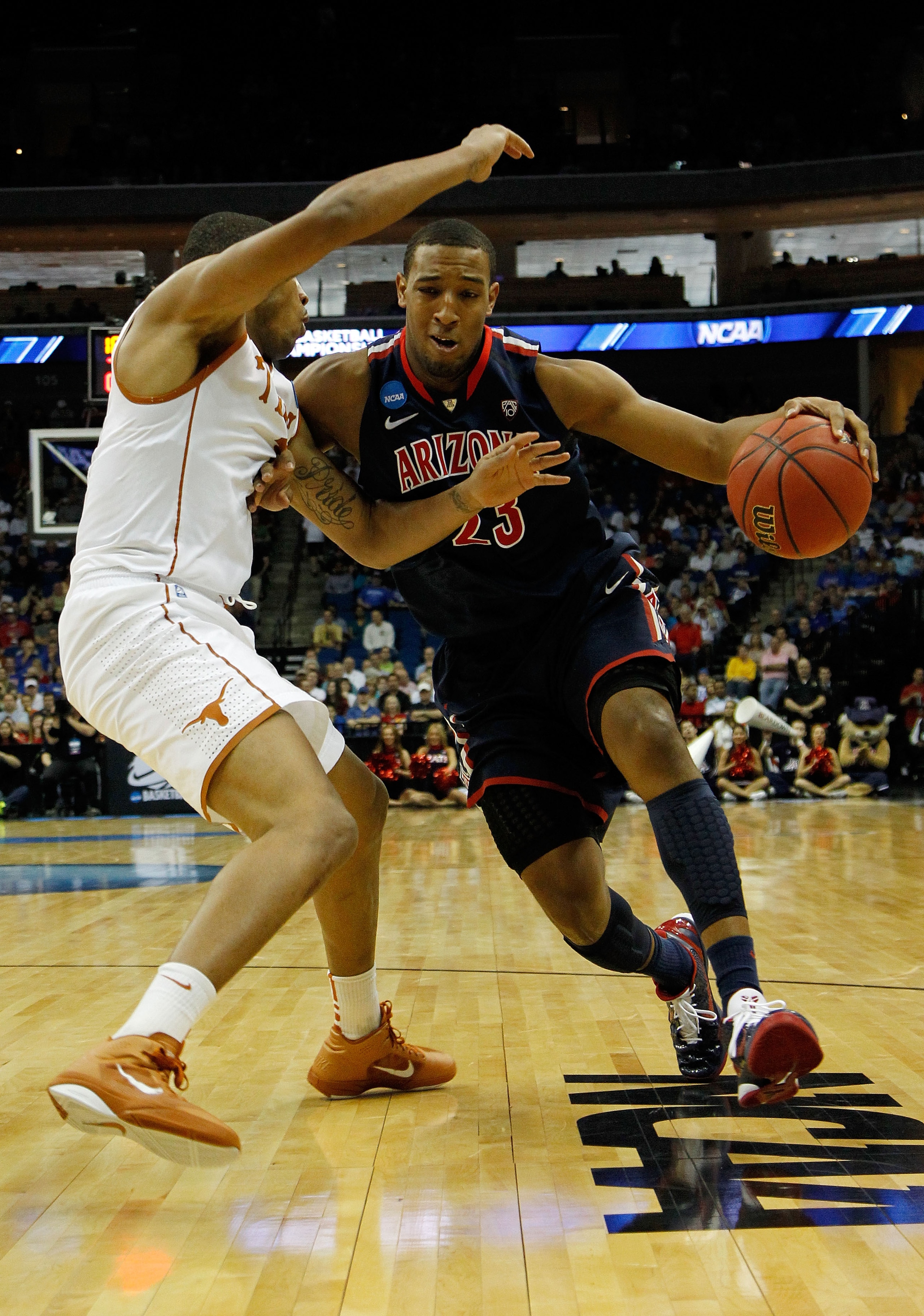 TULSA, OK - MARCH 20: Derrick Williams #23 of the Arizona Wildcats drives with the ball against Gary Johnson #1 of the Texas Longhorns during the third round of the 2011 NCAA men's basketball tournament at BOK Center on March 20, 2011 in Tulsa, Oklahoma. TULSA, OK - MARCH 20: Derrick Williams #23 of the Arizona Wildcats drives with the ball against Gary Johnson #1 of the Texas Longhorns during the third round of the 2011 NCAA men's basketball tournament at BOK Center on March 20, 2011 in Tulsa, Oklahoma.