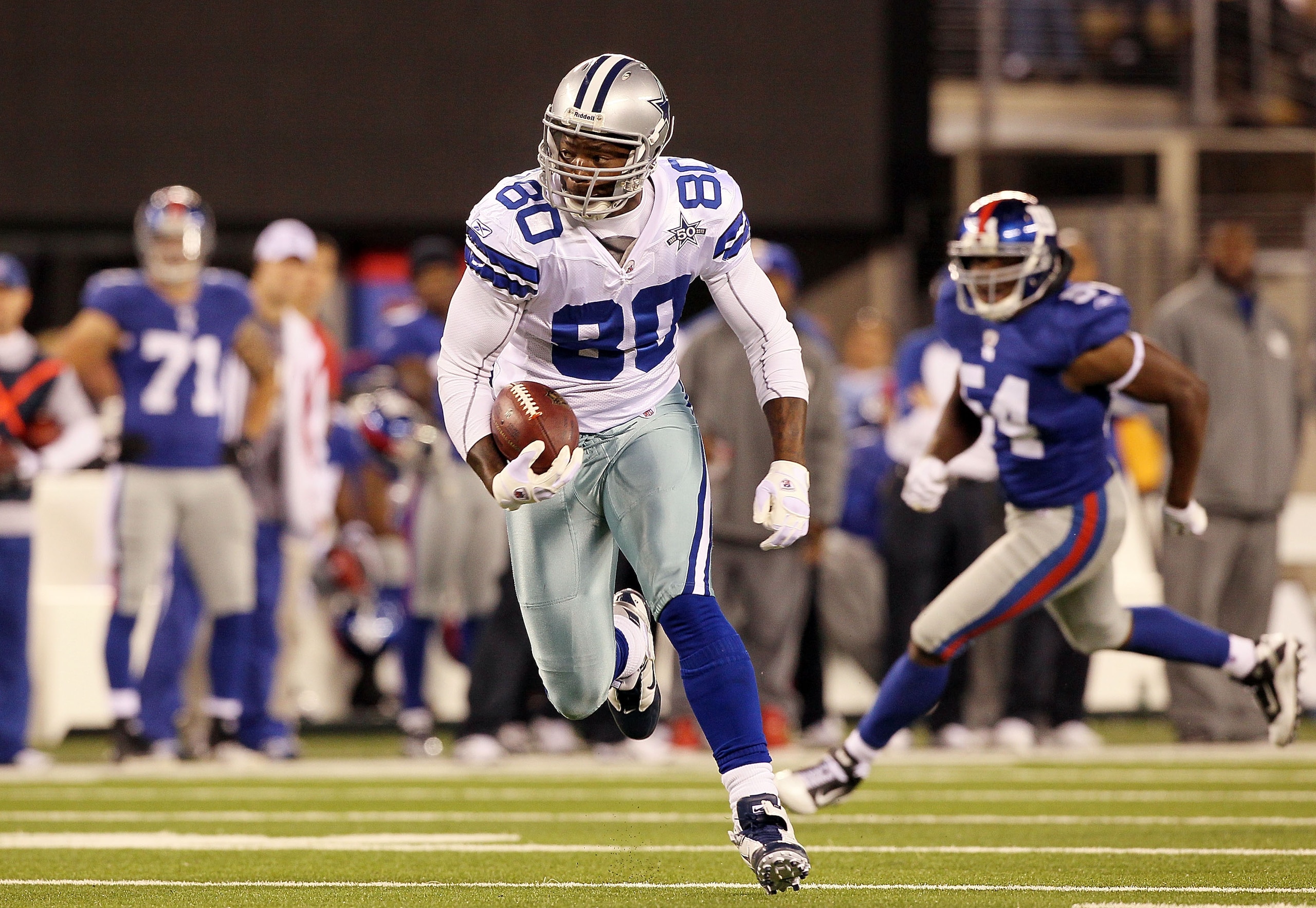 EAST RUTHERFORD, NJ - NOVEMBER 14: Martellus Bennett #80 of the Dallas Cowboys runs a reception against the New York Giants on November 14, 2010 at the New Meadowlands Stadium in East Rutherford, New Jersey.  (Photo by Jim McIsaac/Getty Images)