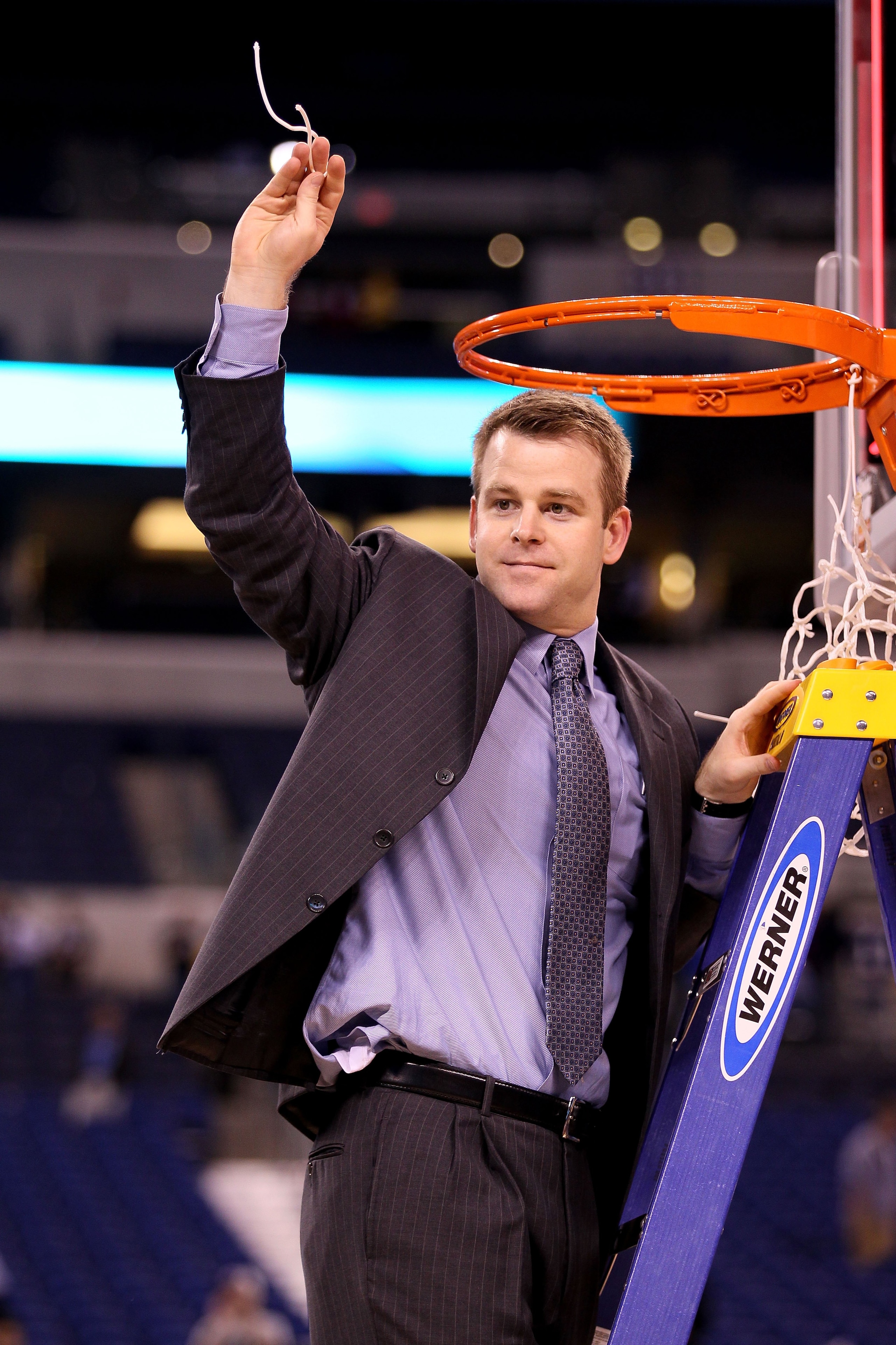 INDIANAPOLIS - APRIL 05:  Associate Head Coach Steve Wojciechowski of the Duke Blue Devils celebrates after he cut down a piece of the net following their 61-59 win against the Butler Bulldogs during the 2010 NCAA Division I Men's Basketball National Cham