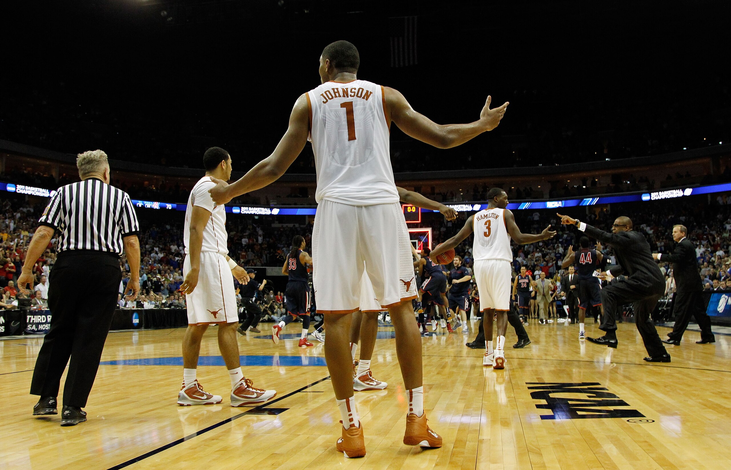 TULSA, OK - MARCH 20:  Gary Johnson #1 of the Texas Longhorns looks to referee Jim Burr after time had expired in their game against the Arizona Wildcats during the third round of the 2011 NCAA men's basketball tournament at BOK Center on March 20, 2011 i