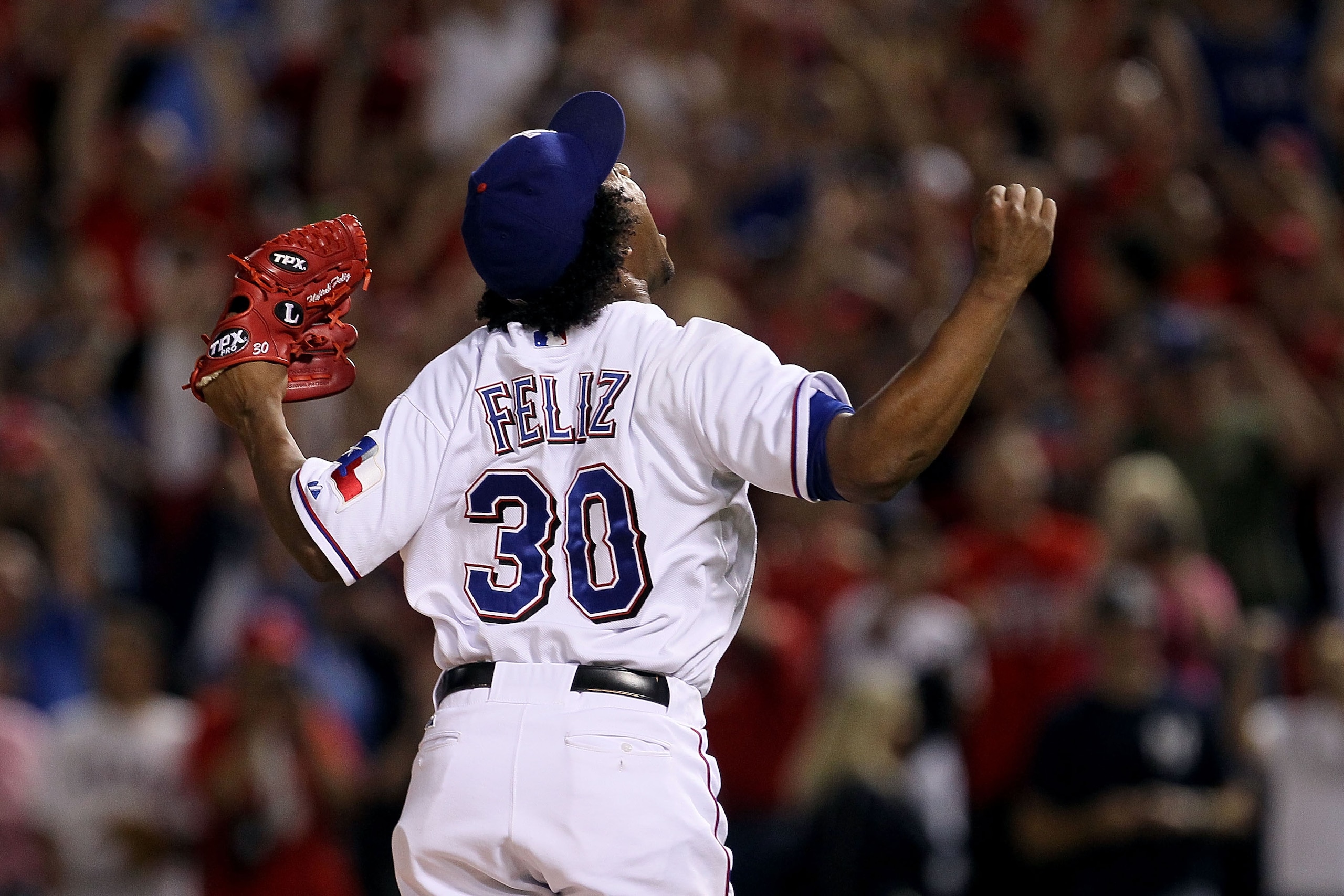 ARLINGTON, TX - OCTOBER 22:  Neftali Feliz #30 of the Texas Rangers celebrates after defeating the New York Yankees  6-1 in Game Six of the ALCS during the 2010 MLB Playoffs at Rangers Ballpark in Arlington on October 22, 2010 in Arlington, Texas.  (Photo