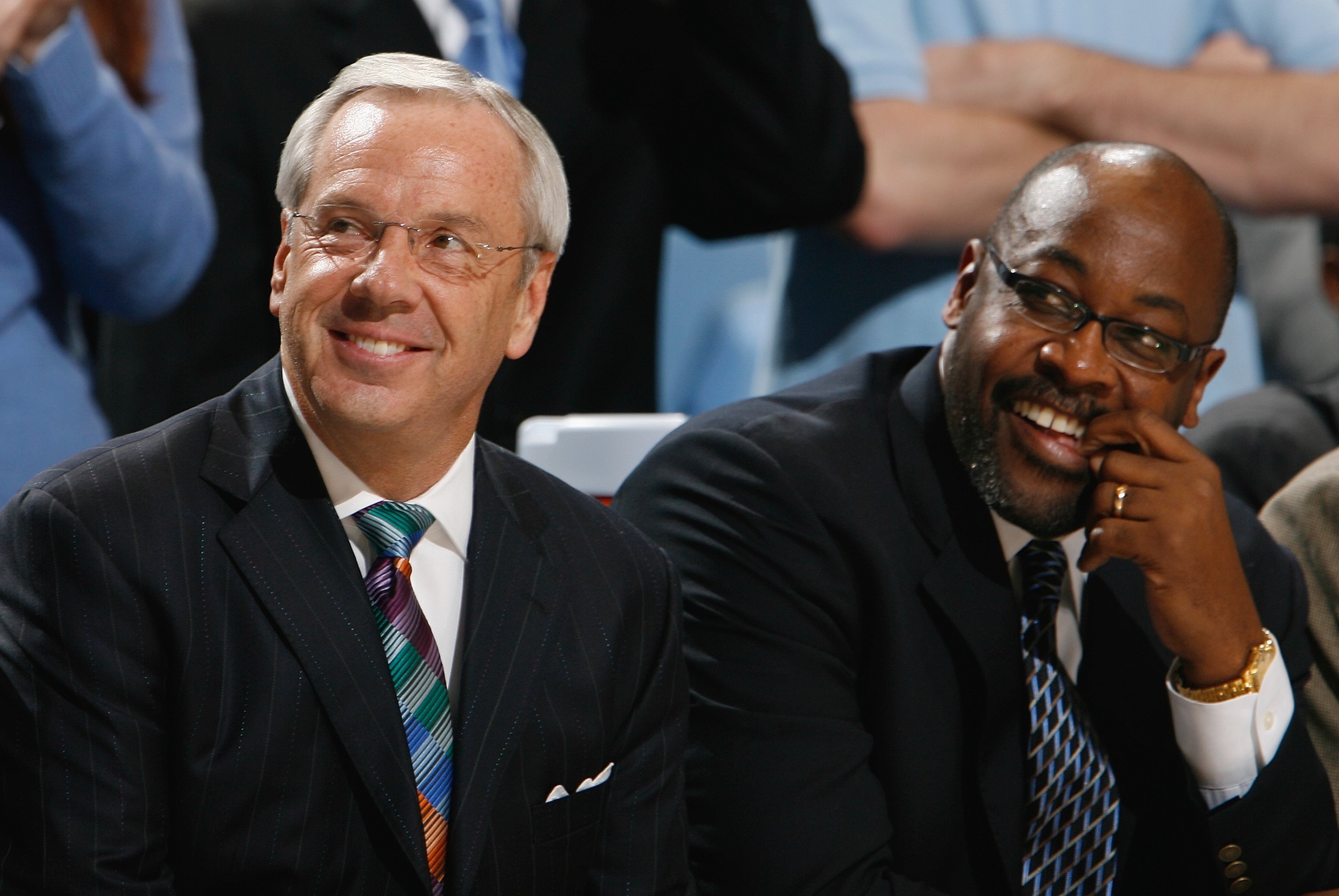 CHAPEL HILL, NC - DECEMBER 19:  Head Coach Roy Williams and Assitant Coach Steve Robinson of the North Carolina Tar Heels enjoy the action from the bench during the game against the Nicholls State Colonels during the second half at the Dean E. Smith Cente