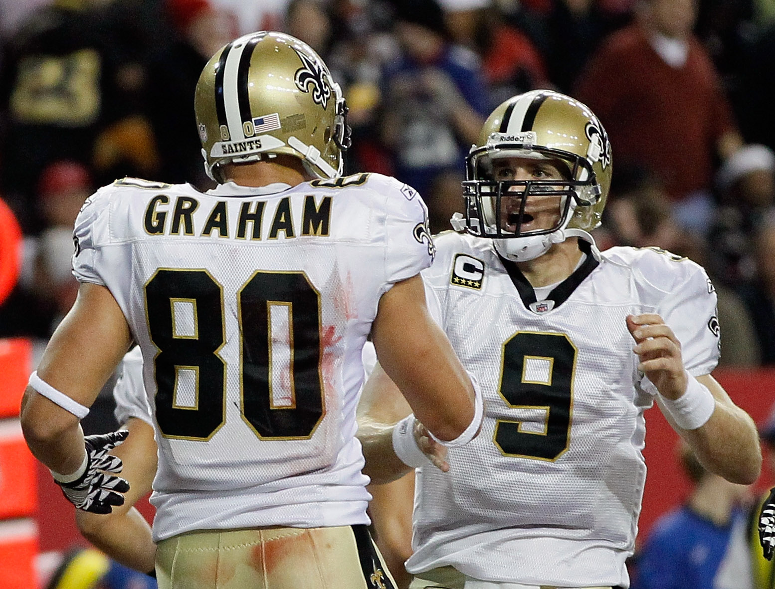 ATLANTA, GA - DECEMBER 27:  Quarterback Drew Brees #9 of the New Orleans Saints celebrates a touchdown pass to Jimmy Graham #80 in the second half during the game against the Atlanta Falcons at the Georgia Dome on December 27, 2010 in Atlanta, Georgia.  (