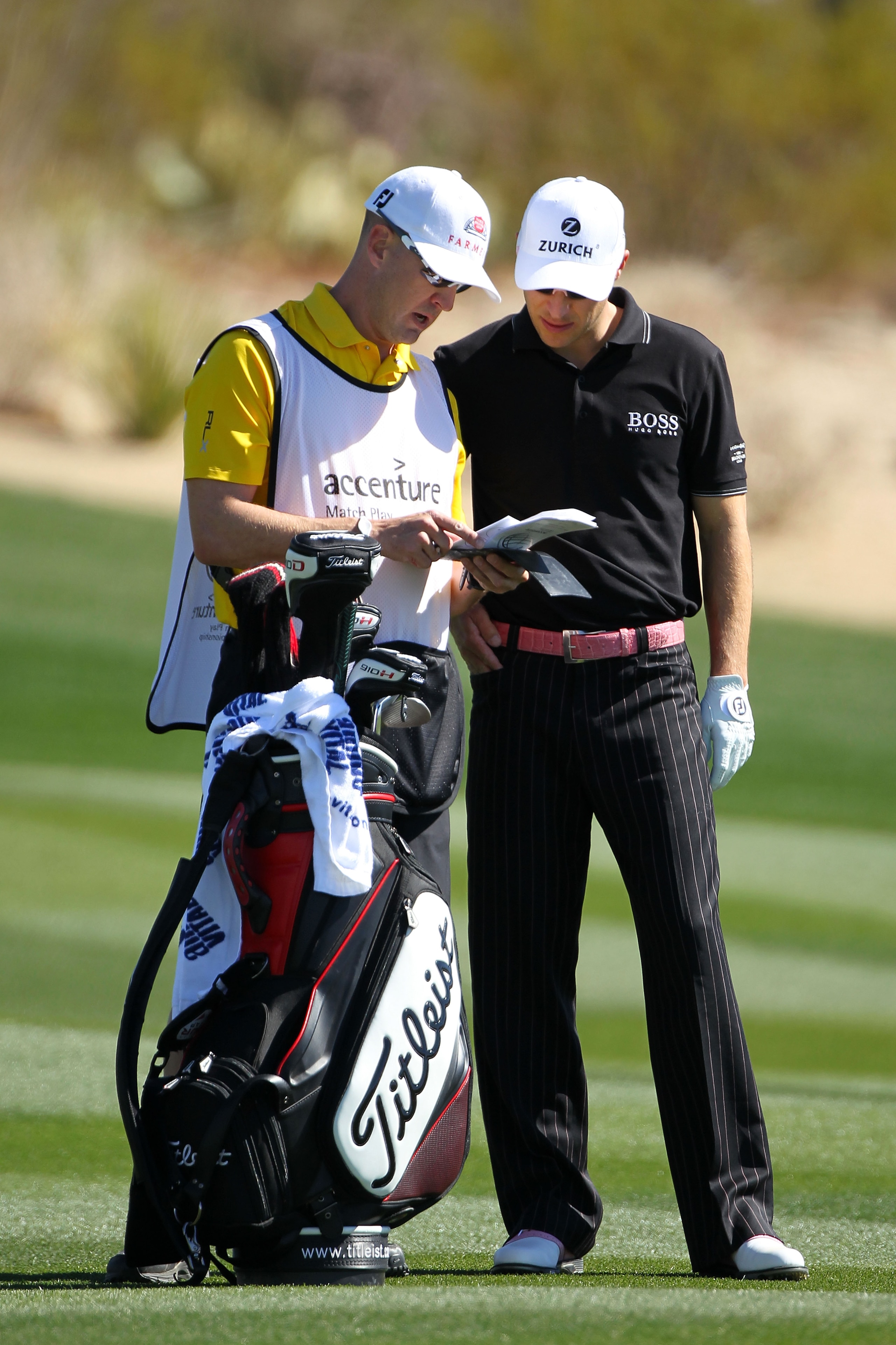 MARANA, AZ - FEBRUARY 25:  (L-R) Caddie Joel Stock and Ben Crane talk on the second hole fairway during the third round of the Accenture Match Play Championship at the Ritz-Carlton Golf Club on February 25, 2011 in Marana, Arizona.  (Photo by Andy Lyons/G