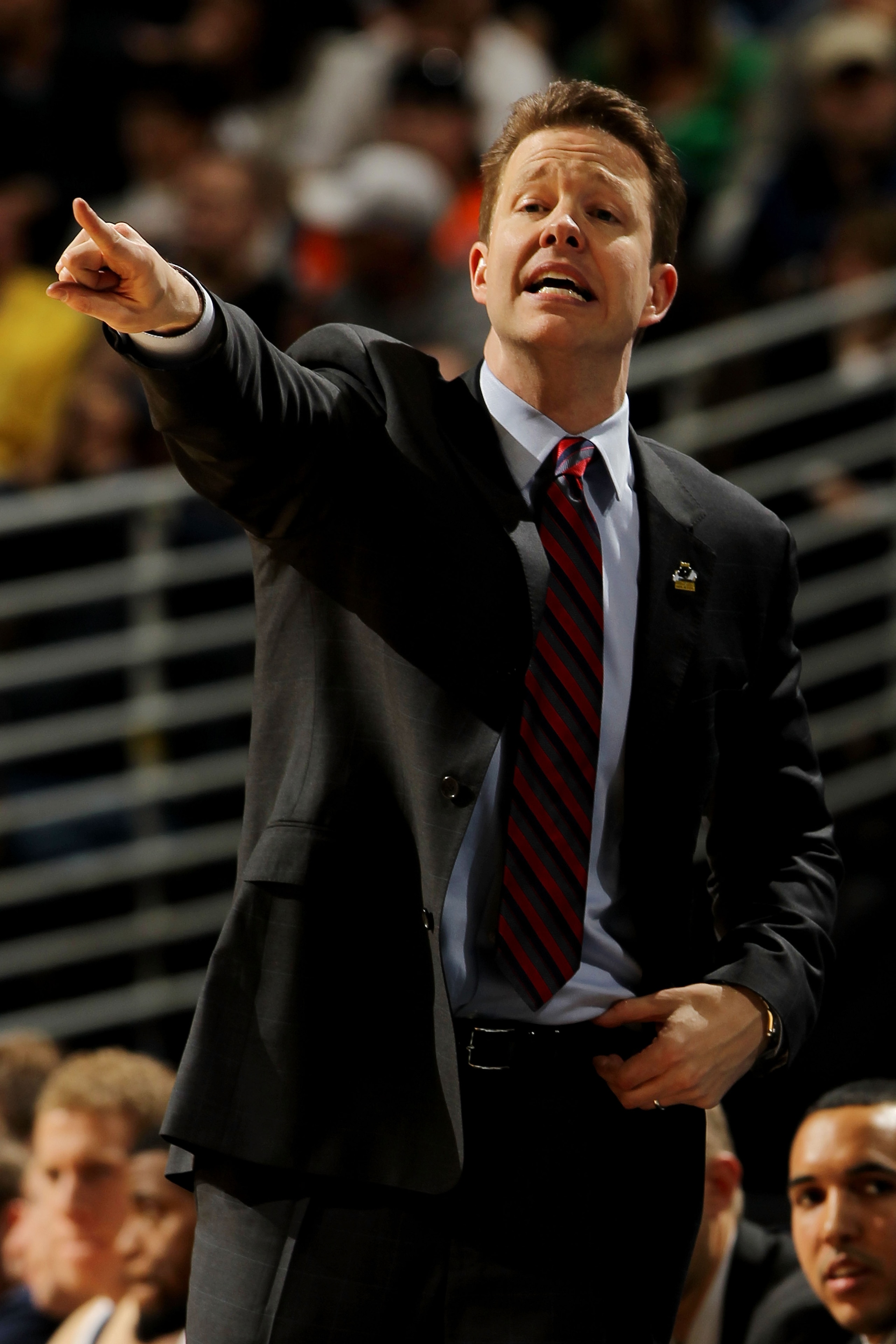 DENVER, CO - MARCH 17:  Head coach Chris Mooney of the Richmond Spiders gestures from the bench during the second round of the 2011 NCAA men's basketball tournament at Pepsi Center on March 17, 2011 in Denver, Colorado.  (Photo by Doug Pensinger/Getty Ima