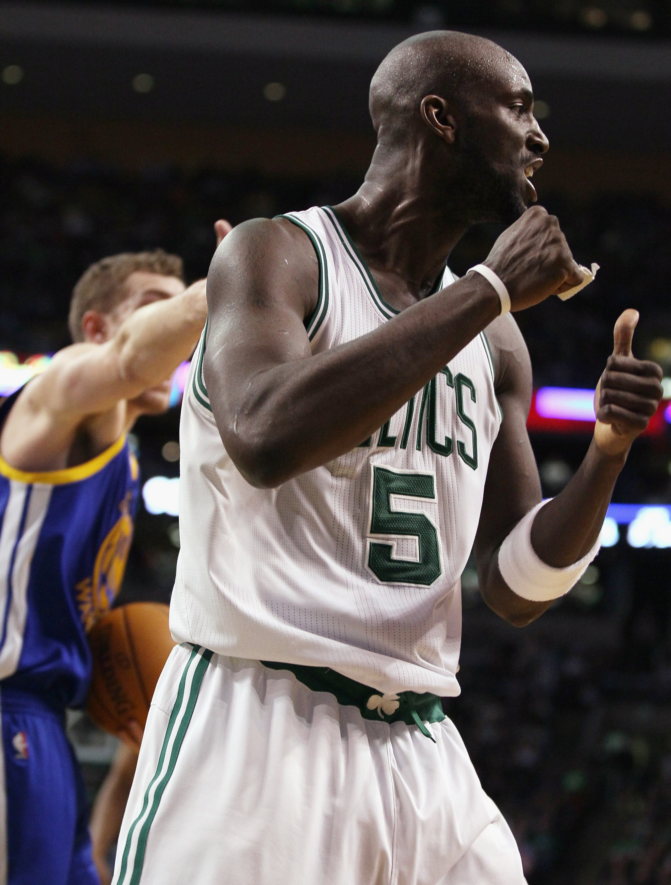 BOSTON, MA - MARCH 04:  Kevin Garnett #5 of the Boston Celtics celebrates the jump ball in the fourth quarter against the Golden State Warriors on March 4, 2011 at the TD Garden in Boston, Massachusetts.  The Celtics defeated the Warriors 107-103. NOTE TO