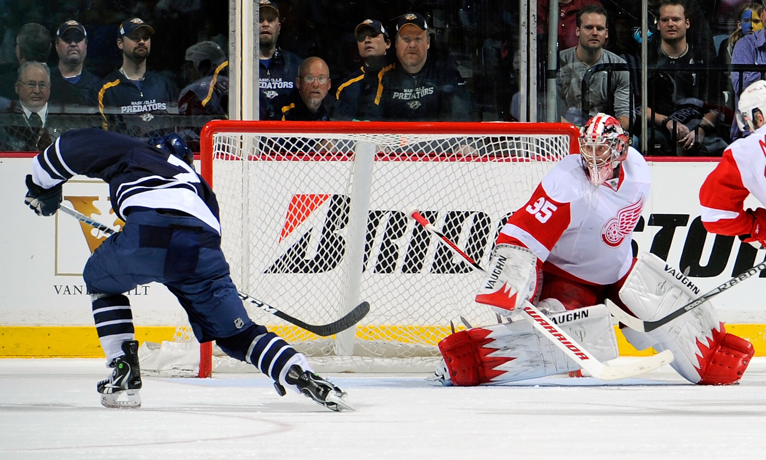 NASHVILLE, TN - MARCH 19:   Jonathon Blum #7 of the Nashville Predators scores the eventual game winning goal against Jimmy Howard #35 of the Detroit Red Wings on March 19, 2011 at the Bridgestone Arena in Nashville, Tennessee.  (Photo by Frederick Breedo