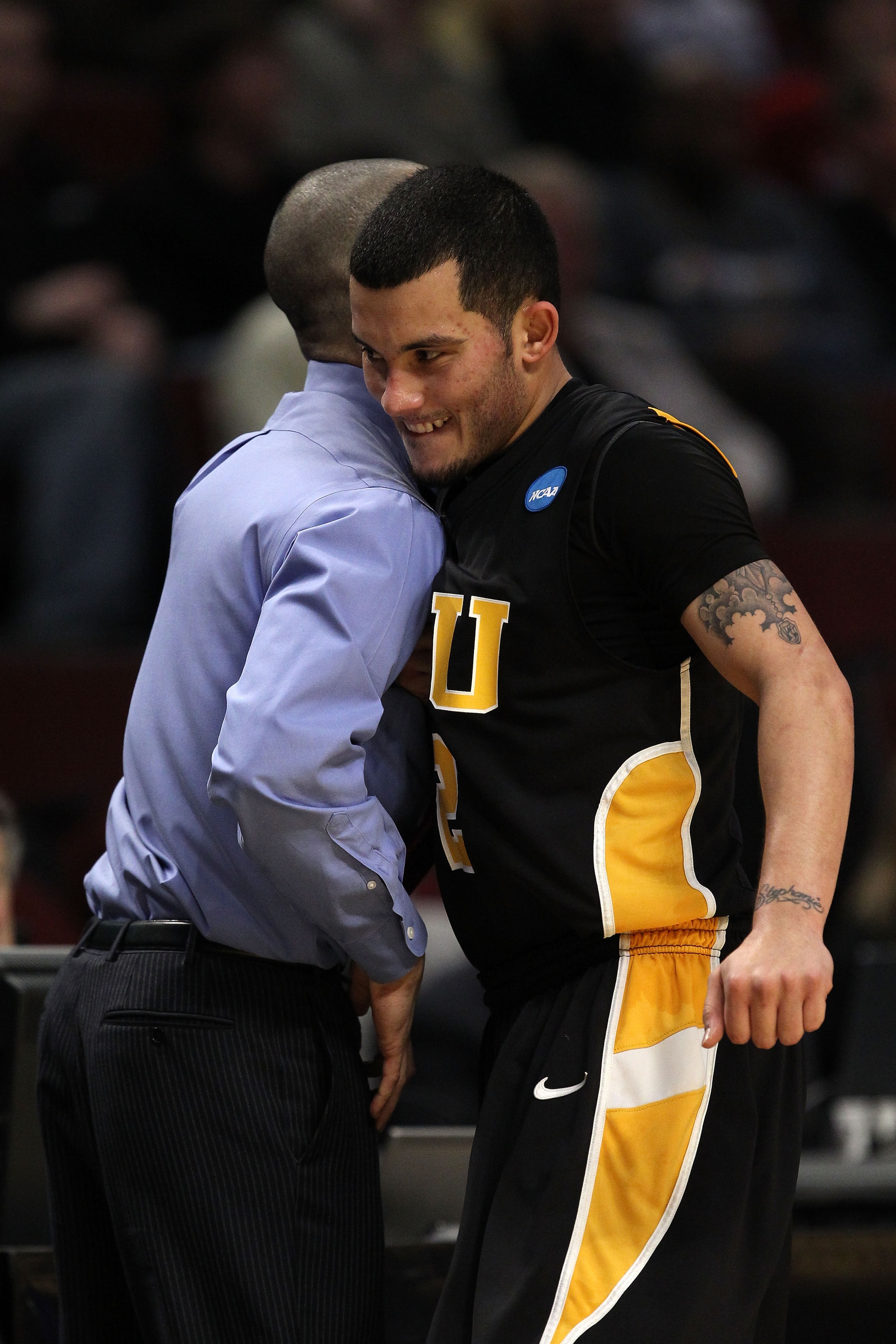 CHICAGO, IL - MARCH 18:  Joey Rodriguez #12 of the Virginia Commonwealth Rams celebrates with head coach Shaka Smart after defeating the Georgetown Hoyas during the second round of the 2011 NCAA men's basketball tournament at the United Center on March 18
